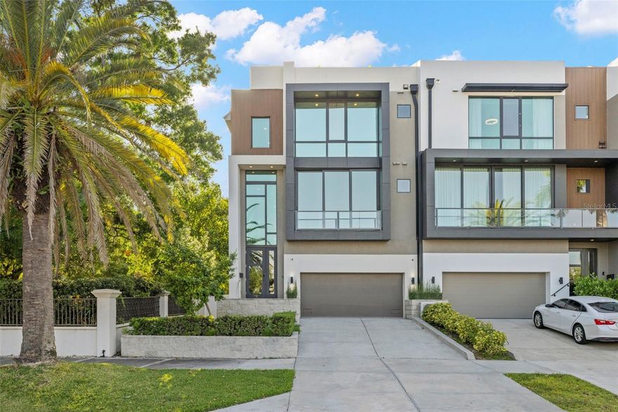 FRESH NEW PRICE! Owners open to renting, or lease to buy. Welcome to 98 W Davis Blvd, an exquisite luxury townhouse nestled in the heart of prestigious Davis Islands in Tampa, Florida. Built in 2022, this exceptional residence exemplifies modern sophistication and convenience, serving as the final masterpiece of acclaimed designer Tommy Lamb. From its meticulously curated details to its thoughtfully designed layout, every element of this home reflects the pinnacle of high-end living. Upon entry, the first floor reveals a versatile bonus room complete with a wet bar—an ideal space for entertaining guests. Adjacent to this is a spacious guest suite featuring an en-suite bathroom with custom built-ins, a dedicated makeup vanity, and direct access for use as a pool bath. The second floor is designed for both elegance and functionality, offering a formal living room with a sleek ventless fireplace, a sophisticated dining area, a powder bath, and a chef-inspired kitchen. Outfitted with top-of-the-line Wolf appliances, a Sub-Zero refrigerator, and a stunning waterfall island that comfortably seats four, the kitchen is further enhanced by a striking quartz feature wall, dual pantries, and abundant cabinetry. Nearby, a cozy family room and a glass-enclosed wine room—showcasing the floating staircase—complete the floor. Ascend to the third level where you’ll find another guest suite with a walk-in closet, a dedicated laundry room with dual washer and dryer sets, and a breathtaking master suite. The master retreat features a private balcony, an expansive walk-in closet with sleek black built-ins and gold accents, and a spa-inspired en-suite bathroom. Indulge in the freestanding black soaking tub, oversized shower with multiple heads, and dual vanities designed for both function and flair. For added ease, an elevator services all levels of the home. The two-car garage offers generous space, including room for a golf cart. Retreat to your own private rooftop where you can soak up the beautiful Florida sunsets and enjoy water views perfect for both intimate relaxation and vibrant entertaining. Located on the coveted Davis Islands, this property provides not only a refined lifestyle but also a family-friendly environment. Residents enjoy access to top-rated A+ schools and a vibrant, picturesque community just moments from downtown Tampa. Don’t miss the rare opportunity to own this extraordinary residence. Contact us today to schedule a private tour and experience luxury redefined at 98 W Davis Blvd. Bring an offer!!