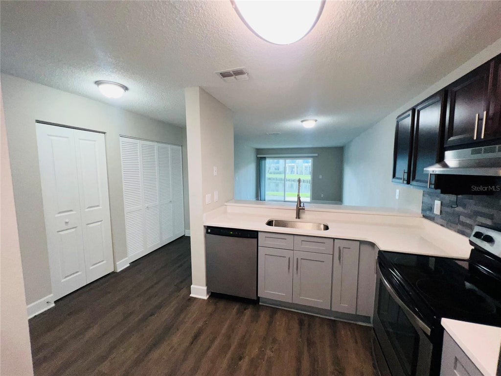 Photo of 2556 Woodgate Boulevard #103, Orlando, FL 32822 (MLS # O6422367)