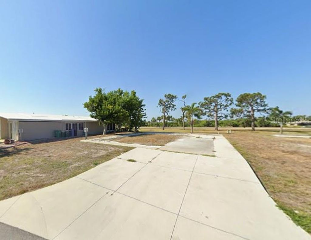 Photo of 7560 Danvers Cir, Port Charlotte, FL 33981 (MLS # D6145373)