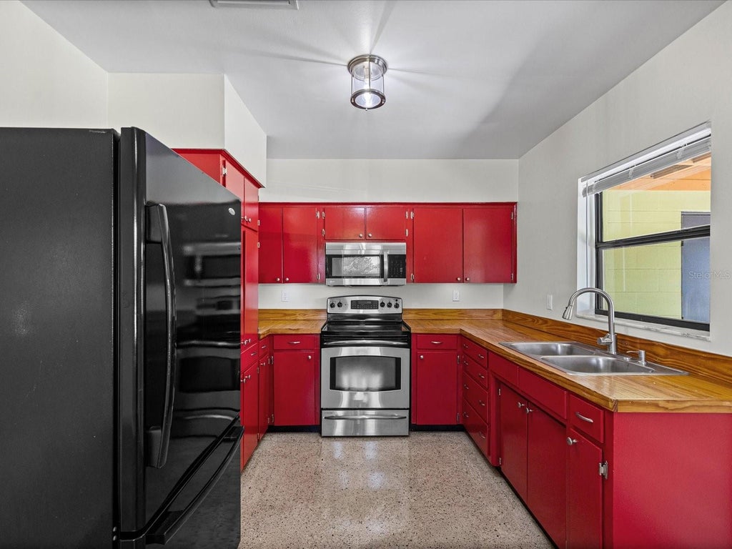 Photo of 7002 Thrasher Drive, Tampa, FL 33610 (MLS # TB8543735)