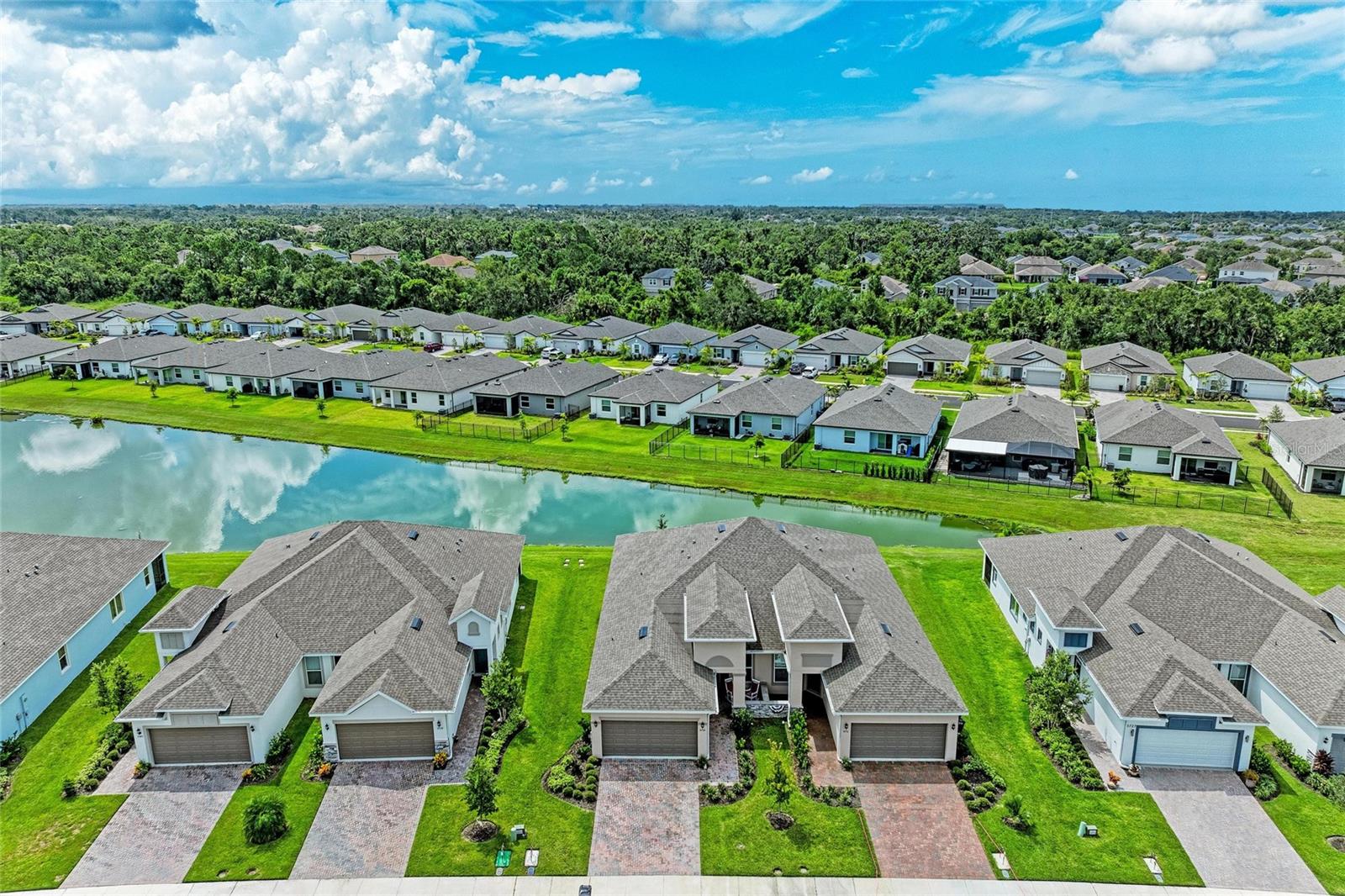 Florida Living at Its Finest – Best Value in Trevesta!
Welcome to your dream retreat in the highly sought-after gated community of Trevesta, nestled in the heart of Palmetto! This beautifully appointed lakefront villa offers the perfect blend of simple luxury, comfort, and low-maintenance living — ideal for year-round enjoyment or seasonal escapes.
Step inside to discover an open-concept floor plan bathed in natural light, where expansive lake views steal the show from the moment you enter. The spacious great room flows effortlessly into a modern kitchen featuring stone countertops, stainless steel appliances, a large island, and plenty of storage — perfect for entertaining or relaxed everyday living.
Wake up to serene water views from the primary suite, which boasts a walk-in closet and an en-suite bath with dual vanities and a glass-enclosed shower. A split bedroom layout offers privacy for guests, or family members.
Walk out the wall of glass sliders leading to the screened lanai to enjoy your morning coffee or evening wine, overlooking the peaceful lake and lush landscaping — a tranquil setting you’ll never tire of.
Highlights include:
*Lawn care, exterior maintenance, and irrigation included*
*Energy-efficient construction and hurricane shutters*
*Meticulously maintained, lives like brand new*
Trevesta offers a resort-like lifestyle with walking trails, playgrounds, and easy access to I-75, I-275, and US 41 — placing you minutes from shopping, dining, the beautiful Gulf beaches, and everything the Tampa Bay and Sarasota areas have to offer.
Schedule your private tour today & start living a life you don't need a vacation from!