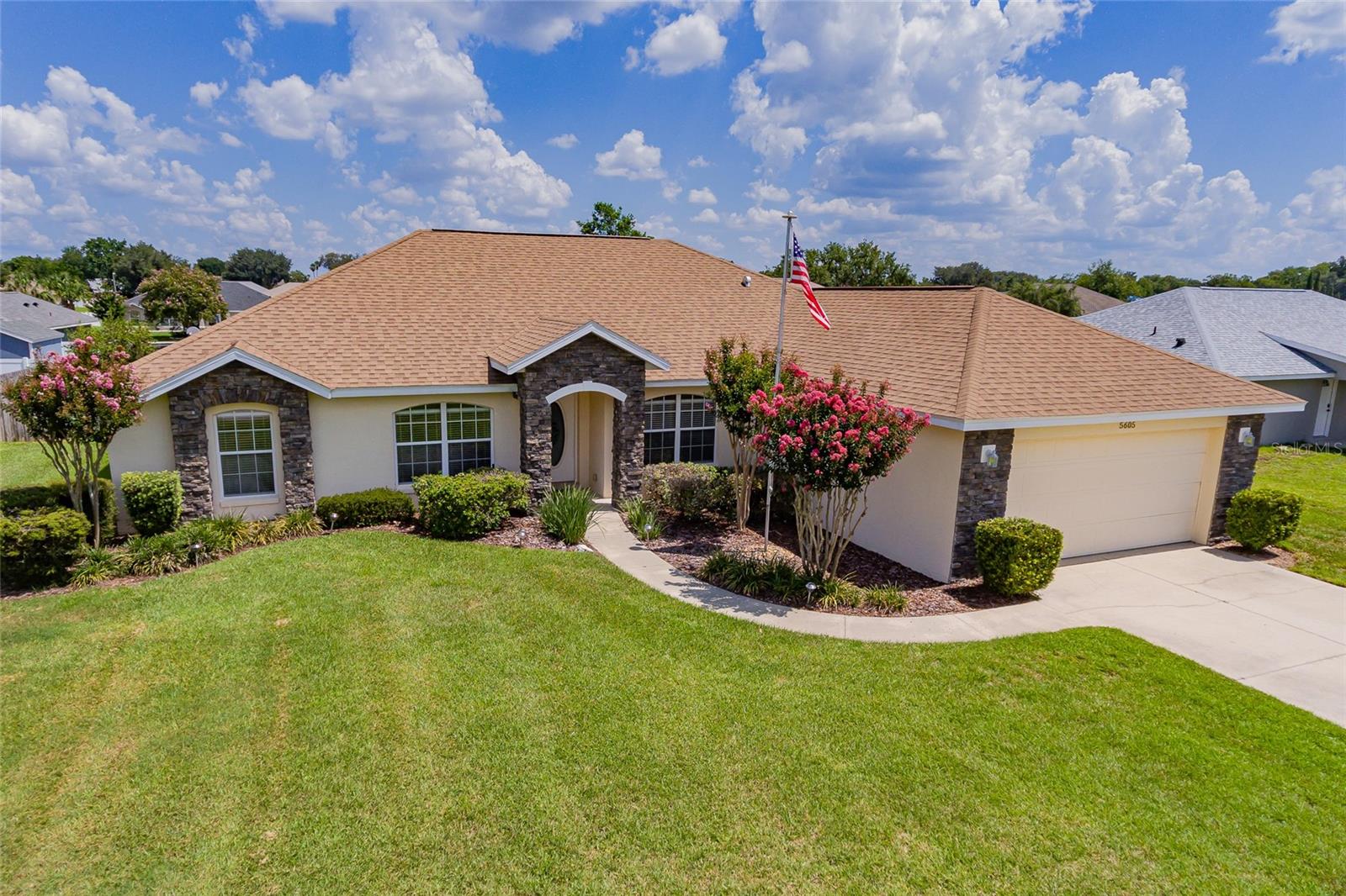 Location, Location, Location! Majestic Oaks is one of Ocala's highly sought after communities. With one of the lowest HOA fees in the area, this well maintained, clean, and friendly neighborhood is a must see! As soon as you drive up the beautiful landscaping and the stone facade of the front of this home will captivate your attention. This charming home in Majestic Oaks with over 2300 living square feet is a well cared for block home that has 3 bedrooms and 2 full baths plus a den with pocket doors, perfect for that home office or separate TV room. You’ll love the open floor plan with a great view as soon as you enter the home with its high cathedral ceilings along with so much natural light to appreciate. The great room has a corner fireplace that acts as the focal point of the home. This leads out to the screened lanai via sliding doors. The main area of the home has beautiful new LVP flooring. I can't say enough about the spacious KITCHEN that has lots of cabinet space and Corian countertop work space. All of the kitchen appliances are included, along with a new reverse osmosis system. The washer and dryer are also included. Enjoy hosting family dinners in both the formal dining room and the eat in kitchen. The MASTER BEDROOM is very spacious with trey ceiling and adjoins a generous walk-in closet, both with brand new LVP flooring. The MASTER BATHROOM is so light and airy and has double sinks, a lovely garden tub and a walk-in shower. The water closet provides a little room for privacy. The additional bedrooms have lots of great space and are on the opposite side of the home right next to the second bathroom. The second bathroom has single sink vanity along with a full tub and shower. Other recent updates include: 5-ton A/C - 2024, Interior Painting - 2020, New Roof - 2019, and Water Heater - 2018. Fenced for privacy, the backyard is ready for a fire pit, and other activities. And the yard is large enough for a pool to be added. There is a spacious 2 car garage for parking and protecting your vehicles. This South West location is close to shopping, restaurants and hospitals. Call today to see this lovely home!
