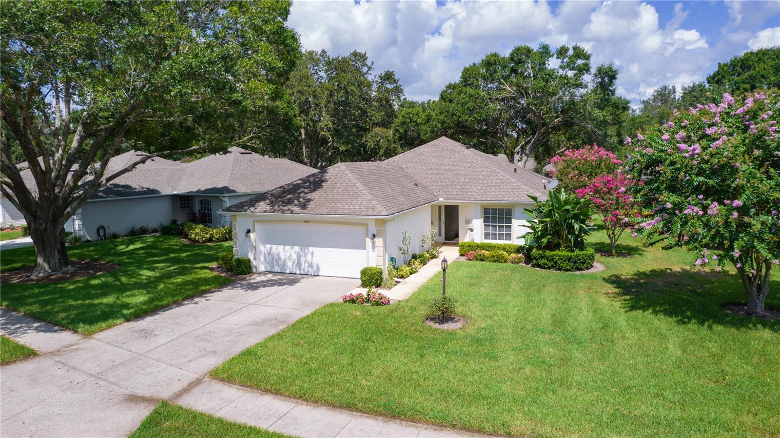 WELCOME TO BAYTREE, one of the most picturesque 55+ Communities in Tavares. Conveniently located close to shopping, dining, and lakefront activities, you will LOVE living here! Upon entering the canopy-lined streets, you will notice the pride taken in this golf cart friendly community with the manicured landscaping of each home. A glass door welcomes guests to your tasteful 2 bedroom, 2 bath home plus bonus room, stylishly upgraded with wood floors and built-in shelving in the living room. The kitchen is updated with newer cabinets, granite counters and a custom banquette nook, complete with table, chair and a large window with a view. The light and bright, open floor plan is inviting with easy access to dining room, kitchen, bonus room. French doors open to the bonus room for use as a library, office, TV room. The large screened patio is perfect for your morning coffee or favorite evening beverage overlooking the peaceful green space with its birds and sand cranes! BAYTREE is a low maintenance lifestyle ... with friendly neighbors, clubhouse activities and special events. Life is relaxing in BAYTREE. Lawn maintenance is included in the affordable HOA, as well as annual pressure washing of the home. Your sprinkler system is metered and recycled, so no water bill for the lawn! HOA amenities include a clubhouse with pool, library, exercise room, pickle ball court and a recreation room for many activities, including monthly dinners. The spacious primary bedroom has a walk-in closet, ensuite bathroom with shower, and overlooks the rear green space. The guest bedroom faces the front of the home and also has a shower and walk-in closet. This home has new plumbing 2024, new hot water heater 2023 and roof in 2018. This inside laundry room includes washer, dryer and cabinets for extra storage. Seller is offering a home warranty to the new owner as well as paying the one-time fee of $1830 capital assessment requirement for new purchases. BAYTREE is located close to downtown Tavares Wooten Park, and a short drive to the many events in downtown Mount Dora. Hurry to see this great opportunity to live in this FABULOUS 55 + community. Call for your appointment today!