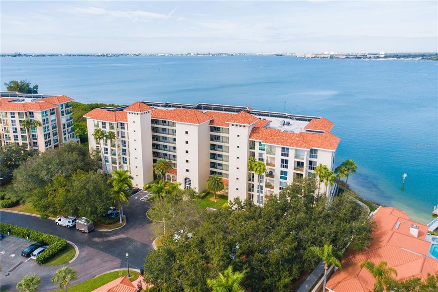 Experience refined waterfront living in this brilliantly renovated corner residence in Antigua at Dolphin Cay, one of St. Petersburg’s most desirable guard-gated coastal communities. Perfectly positioned along Boca Ciega Bay, this exceptional condominium captures panoramic open water views and year-round sunsets from an expansive 40-foot wraparound veranda, creating a seamless connection between indoor elegance and the natural beauty of the waterfront.  Inside, a casual coastal design is defined by walls of windows and abundant natural light, enhancing the open-concept layout and   The chef’s kitchen is stunning and serves as the heart of the home, featuring custom glass cabinetry, quartz countertops, designer backsplash, and stainless appliances—all opening effortlessly to the living and dining areas, ideal for both everyday living and elegant entertaining.  A versatile bonus room with sweeping water views offers exceptional flexibility as a den, office, or potential third bedroom—tailored to today’s lifestyle needs.  The owner’s suite is a private retreat, showcasing a wall of windows, a custom-designed walk-in closet, and a beautifully updated spa-inspired bath. The guest suite is thoughtfully positioned for privacy, with an adjacent bath that has been stylishly renovated.
Refined coastal finishes throughout include a soft coastal palette, crown molding, and plantation shutters, while electric hurricane shutters provide both protection and convenience for the expansive veranda.
Additional features include: a reserved in garage area parking space, Private storage room conveniently located at the corridor entrance, and a well-maintained building with strong community appeal which has undergone all its Milestone and SIRS reports.
Residents of Dolphin Cay enjoy a resort-style lifestyle across 88 acres of lush, gated waterfront grounds, featuring: A Private beach overlooking Boca Ciega Bay, Kayak launch and Fishing pier, Three waterfront heated swimming pools, 3 Har-Tru lighted tennis courts, 
Fitness center and clubhouse and Scenic walking trails through protected natural areas.  
Dolphin Cay is just minutes from the vibrant arts scene, waterfront venues, and renowned dining of Downtown St. Petersburg, as well as the sugar-sand beaches of St. Pete Beach and Pass-a-Grille. Tampa International Airport and St. Pete-Clearwater International Airport are both easily accessible making it one of the most desirable waterfront communities for both primary and second-home buyers.
This is a rare opportunity to own a fully renovated, corner waterfront residence with expansive outdoor living and unobstructed sunset views in one of St. Petersburg’s most exclusive gated communities.