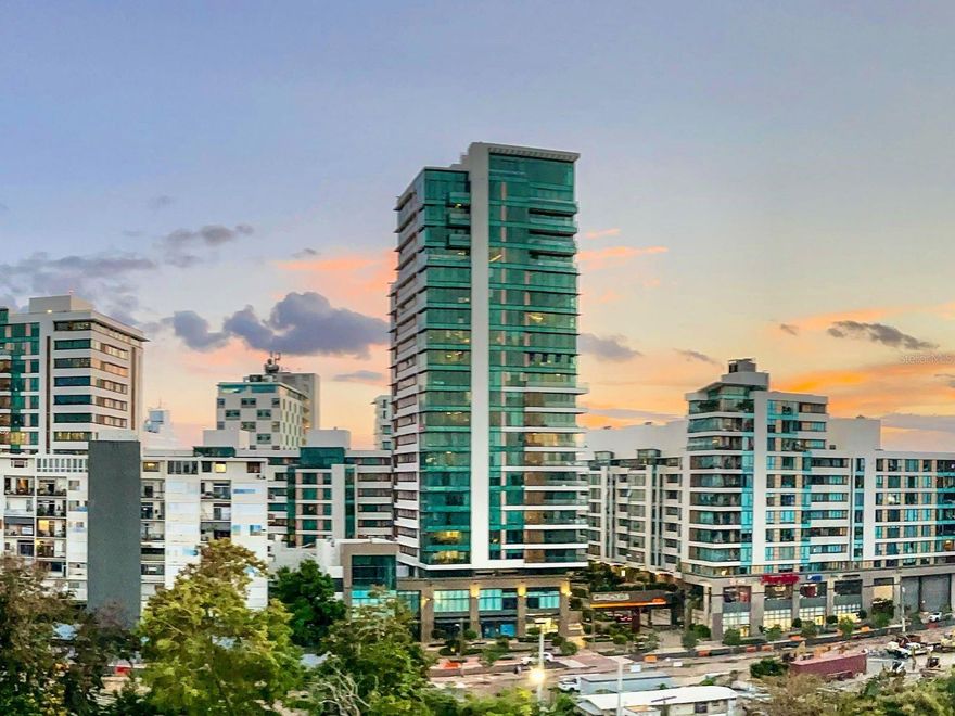 Discover the convenience and lifestyle of Ciudadela in this beautifully appointed two-bedroom, two-bathroom apartment featuring two covered underground parking spaces and full backup generator support. This residence stands out for its expansive and private terrace directly accessible from the primary bedroom—an ideal extension of your living space perfect for relaxing, entertaining, or working outdoors with total privacy.
Inside, the unit offers a functional layout, modern finishes, and high-speed internet included. Both bedrooms are generously sized, and the primary suite features direct terrace access, excellent natural light, and privacy.
Located within the vibrant Ciudadela community, residents enjoy unmatched walkability and on-site amenities including:
24/7 Pueblo Supermarket
Restaurants + cafés
Retail shops
Spa services
Planet Fitness gym
Optional membership-access pool
Ciudadela continues to be one of Santurce’s most desirable urban communities, offering convenience, security, and a lifestyle-focused environment just steps from everything.