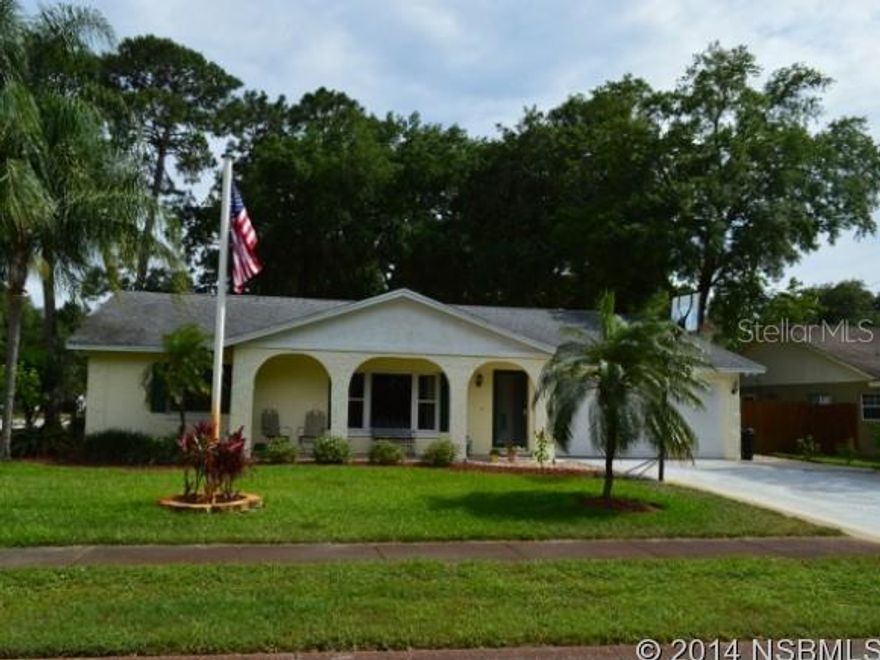 This 3/2 home has an open and bright feel the minute you walk in! You won't get tired of driving up to this beautifully landscaped & well-manicured lawn and into the oversized driveway (perfect to house a boat or RV on the side). This open floor plan allows you go through the living room into the kitchen and family room with ease making this a great family flowing environment! Improvements/replacements were complete between 2006 & 2008 to include: well pump and air handler; roof, thermo pane windows, and garage door; & lastly, dishwasher & disposal. The family living room has cathedral ceilings and a wonderful brick fireplace that leads to the beautiful French doors that extend to the bonus room off the back of the home. Bonus room is perfect for an office, play area or guest room with a separate entrance from the back yard. Tile Floors, Berber carpet, upgraded bathroom, brand new blinds, freshly painted, walk-in closets in all bedrooms and huge backyard with wooden deck and 80 sq. ft. workshop makes this home a space youâll never want to leave! Great location - within walking distance to Spruce Creek Elementary and Spruce Creek High Schools. MOVE IN READY, excellent curb appeal!!!! ;Water: City