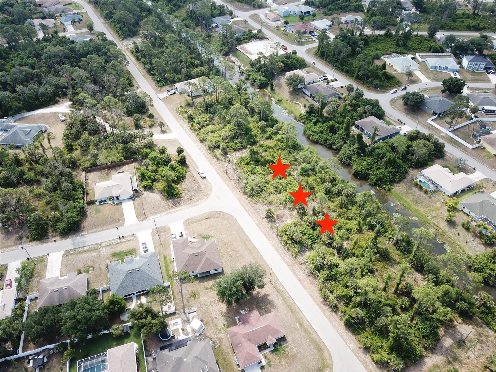 ***PRIME REAL ESTATE*** Incredible RARE opportunity! This is your chance to purchase THREE adjacent lots available on the Blue Bird Waterway, with 240 feet of Water Frontage. These freshwater canal lots present the perfect canvas for building your dream home in vibrant North Port, Florida. Conveniently located near US-41, I-75, Atlanta Braves Spring Training Center, schools, Suncoast Technical College, Shannon Staub Library, shopping, and dining. Easy access to the NEW Costco, Wellen Park, Venice, Port Charlotte & Punta Gorda, as well as numerous golf courses, world-class fishing, boating, and beautiful gulf beaches. Non-flood zone, Flood Zone X as of 5/10/2024. Seller is offering 3 lots together totaling close to 3/4 of an acre, providing a luxurious property opportunity!