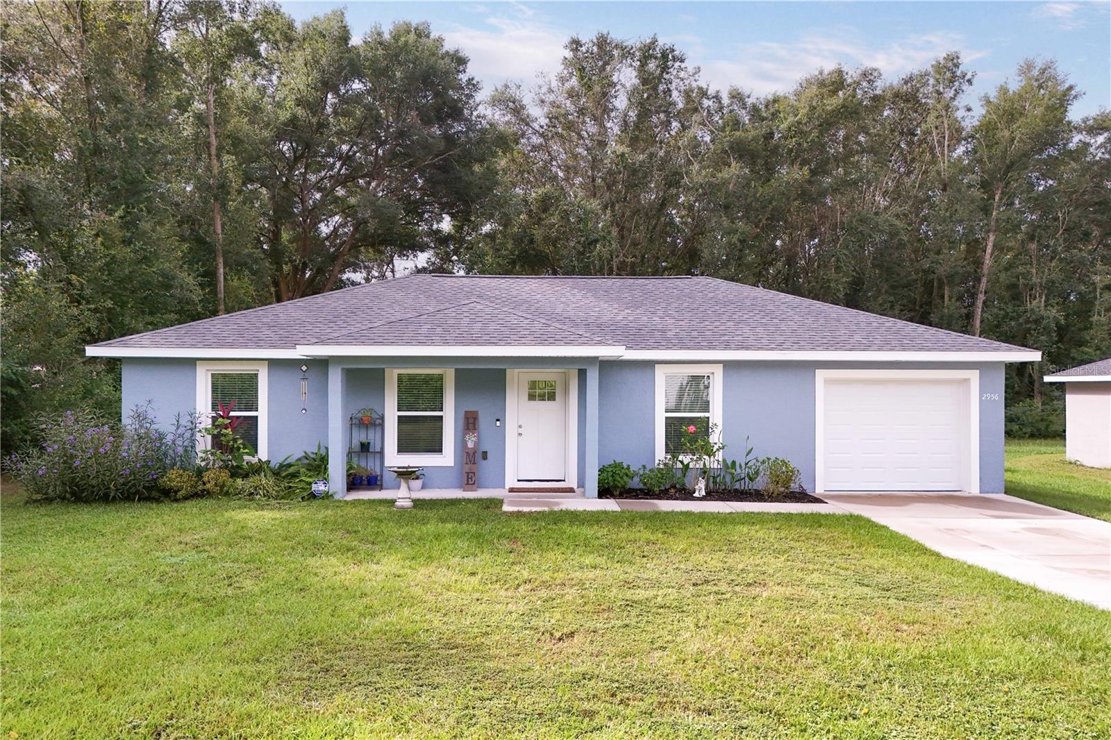 CHARMING MODERN COUNTRY HOME--- BUILT IN 2023---Come experience the perfect blend of country living and modern comfort in this beautifully crafetd 3/2. Step inside to discover Living/dining open concept featuring granite countertops, sliding glass doors that fill the space with natural light. Enjoy clean, high quality water with a WHOLE HOUSE DECHOLRINATION SYSTEM providing peace of mind and comfort for your family. Nestled in a peaceful country setting, this property gives you the serenity of rural life but minutes to shopping, dining, and major conveniences. For those who need a functioning workshop here you go...12x20 with A/C and vinyl flooring can be turned into a man cave, a sheshed or workshoppers dream. Sooo come on down and lets make a deal!!!!