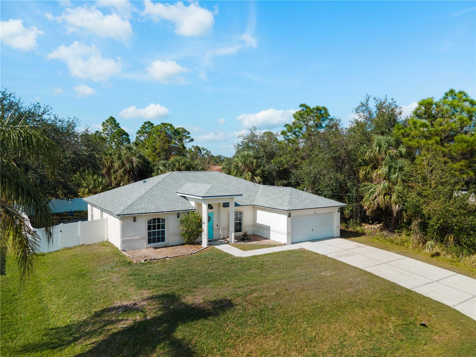 Welcome to 3213 Belleville Terrace, a spacious and inviting single-family home nestled in a serene North Port neighborhood. Built in 2005, this residence offers 1,853 square feet of comfortable living space, featuring 3 bedrooms and 2 bathrooms. The expansive kitchen is a chef's delight, boasting abundant cabinetry, ample counter space, a built-in desk, and modern stainless steel appliances. The open-concept design seamlessly connects the kitchen to the family room, creating an ideal setting for both daily living and entertaining. The master suite provides a tranquil retreat with a generous walk-in closet and a well-appointed en-suite bathroom. Additional highlights include a versatile den that can serve as a fourth bedroom or home office, catering to your specific needs. Step outside to discover a fully fenced backyard, ensuring privacy and security. Notably, this property is situated outside of designated flood zones, offering peace of mind. Conveniently located near I-75, schools, shopping centers, dining establishments, spring training facilities for the Rays and Braves, and the new aquatic center, this home combines comfort, functionality, and accessibility in one exceptional package.