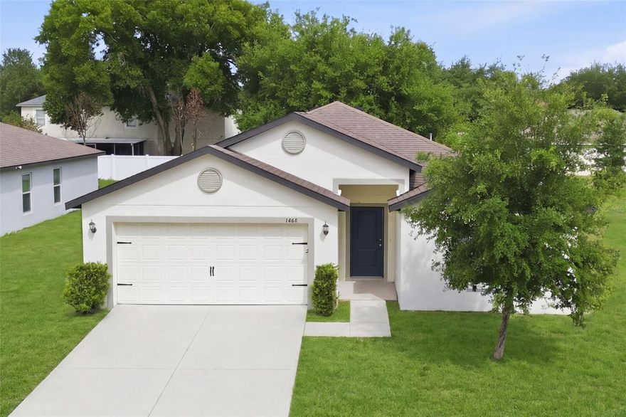 Located at 1668 Gopher Tree St in Mascotte, this well-designed 5-bedroom, 3-bathroom home built in 2020 offers 1,944 square feet of thoughtfully designed living space. The residence features an open-concept layout that seamlessly connects the living, dining, and kitchen areas, highlighted by tile flooring throughout the main living spaces and abundant natural light from well-placed windows. The kitchen is equipped with dark wood cabinetry, ample counter space, a central island, walk-in pantry, and included appliances, creating a practical and inviting setting for everyday living. The primary suite offers a spacious retreat with a large walk-in closet and an ensuite bathroom featuring dual vanities and a walk-in shower, while additional bedrooms provide comfortable accommodations with ample closet space. Step outside to enjoy a covered patio with a large lot, offering a great space for outdoor relaxation. Additional highlights include an indoor laundry area and a two-car garage. The home features a 6 year old roof, HVAC system and water heater, ensuring peace of mind and comfort for years to come. Conveniently located near shopping, dining, and major roadways with easy access to Clermont and Orlando, this property combines modern living with everyday accessibility in a peaceful community setting.