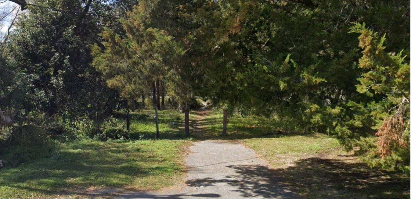 You'll love this impressive 0.48 acre lot, located at the end of a quiet street, of New Port Richey. The Creek Goes around the property. Zoned R1MH (Residential/Mobile Home) on a generous parcel with no standing structure, this oversized lot presents ideal potential for custom construction, mobile home placement, or investment-oriented development. Electric at the street, with your own private well and septic tank to keep costs down. Come see this great opportunity of a place to build your new home!