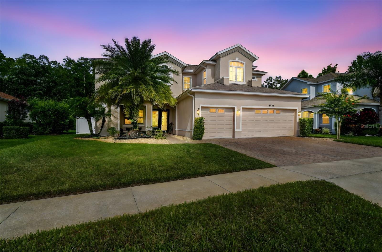 Welcome to this stunning and spacious 6-bedroom, 4-bathroom home offering over 3,600 square feet of living space, situated on an oversized premium lot that backs to a peaceful conservation area with no rear neighbors. Located in the highly sought-after gated community of Lakeshore Ranch, this home features a screened-in lanai, a sparkling pool, a fully fenced backyard, and a beautiful paver driveway leading to a 3-car garage. Inside, you'll find a thoughtfully designed layout including a guest suite downstairs and an impressive primary suite upstairs with double doors, a spacious sitting area, two massive walk-in closets, a garden tub, dual vanities, and a private balcony overlooking the backyard and conservation. Upstairs, two of the bedrooms share a convenient Jack and Jill bathroom, and a large loft and bonus room provide extra space for entertainment or work-from-home needs. The massive open-concept kitchen flows into the family room, complemented by a formal living room, formal dining room with elegant wainscoting, and updated light fixtures throughout. The home also includes an inside laundry room and brand-new flooring throughout. The Lakeshore Ranch community is packed with resort-style amenities including multiple pools, a clubhouse, fitness center, dog park, playgrounds, tennis and pickleball courts, parks, sidewalks, and scenic walking trails. Enjoy the fishing dock, lake access for canoeing and kayaking, an outdoor amphitheater, and regular community social events. Residents benefit from a 24-hour guarded gate, roaming security, and a low HOA that includes cable TV, trash, management, and upkeep of all facilities. Conveniently located near the Suncoast Parkway, I-75, and just minutes from Tampa Bay's top-rated shopping, dining, sports, and entertainment, this home offers the perfect blend of space, luxury, and community living. Schedule your private showing today!