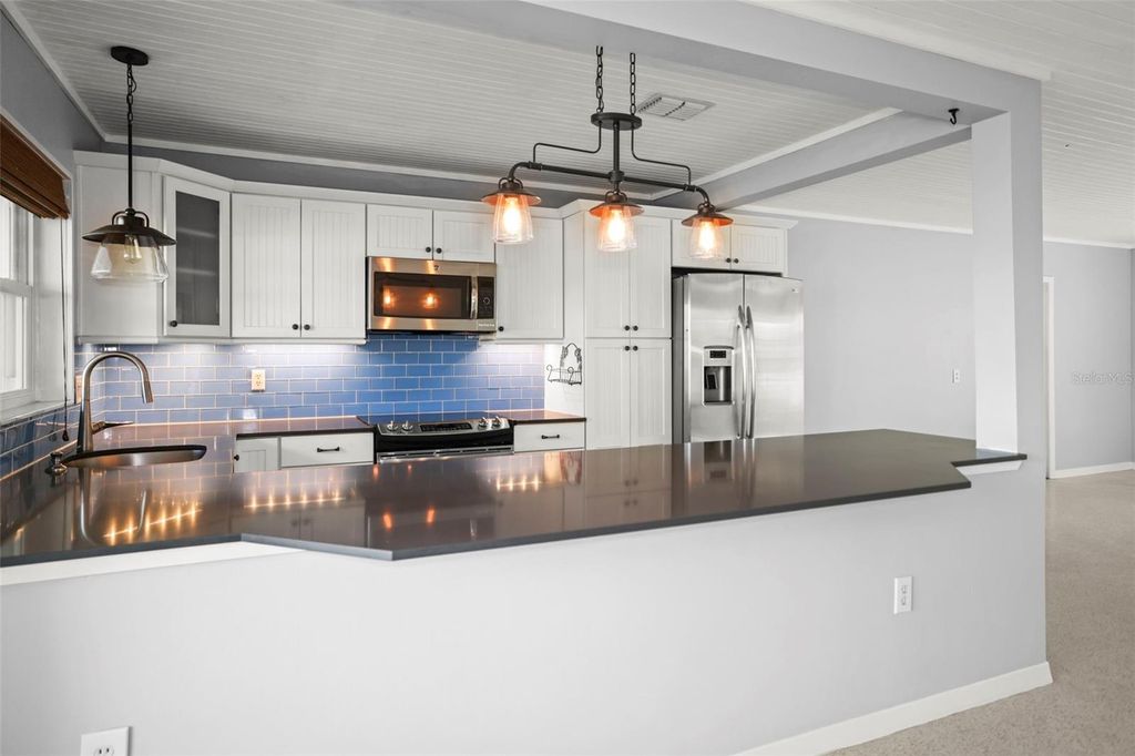 Photo of 951 Greenway Avenue, Dunedin, FL 34698 (MLS # TB8454209)