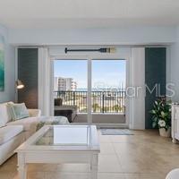 Welcome to your luxurious coastal living NSB condo turnkey and waiting for YOU to call HOME! This beautifully decorated 5th floor condo with stunning ocean views from the moment you walk through the door. The view from your front door and guest bedrooms features an expansive view of the nature preserve and breathtaking views of the sunsets. There is a retractable screen on the balcony is perfect for keep insects out while enjoying the ocean breeze. The primary suite has its own private access to the balcony. The kitchen features cherry cabinets, stainless steel appliances, double oven stove, granite countertops, and a large breakfast bar. Community amenities include: direct access to the no-drive portion of the beach, gated entrances, garage parking, 2 heated pools, 2 fitness centers, 2 clubhouses, basketball, tennis, and shuffle board court, and a raised nature reserve boardwalk trail. Move in ready!! Make this your home TODAY!!