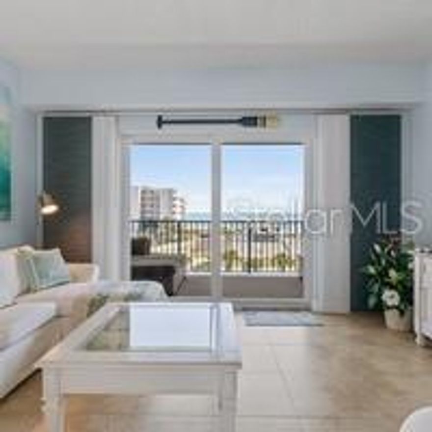 Welcome to your luxurious coastal living NSB condo turnkey and waiting for YOU to call HOME! This beautifully decorated 5th floor condo with stunning ocean views from the moment you walk through the door. The view from your front door and guest bedrooms features an expansive view of the nature preserve and breathtaking views of the sunsets. There is a retractable screen on the balcony is perfect for keep insects out while enjoying the ocean breeze. The primary suite has its own private access to the balcony. The kitchen features cherry cabinets, stainless steel appliances, double oven stove, granite countertops, and a large breakfast bar. Community amenities include: direct access to the no-drive portion of the beach, gated entrances, garage parking, 2 heated pools, 2 fitness centers, 2 clubhouses, basketball, tennis, and shuffle board court, and a raised nature reserve boardwalk trail. Move in ready!! Make this your home TODAY!!