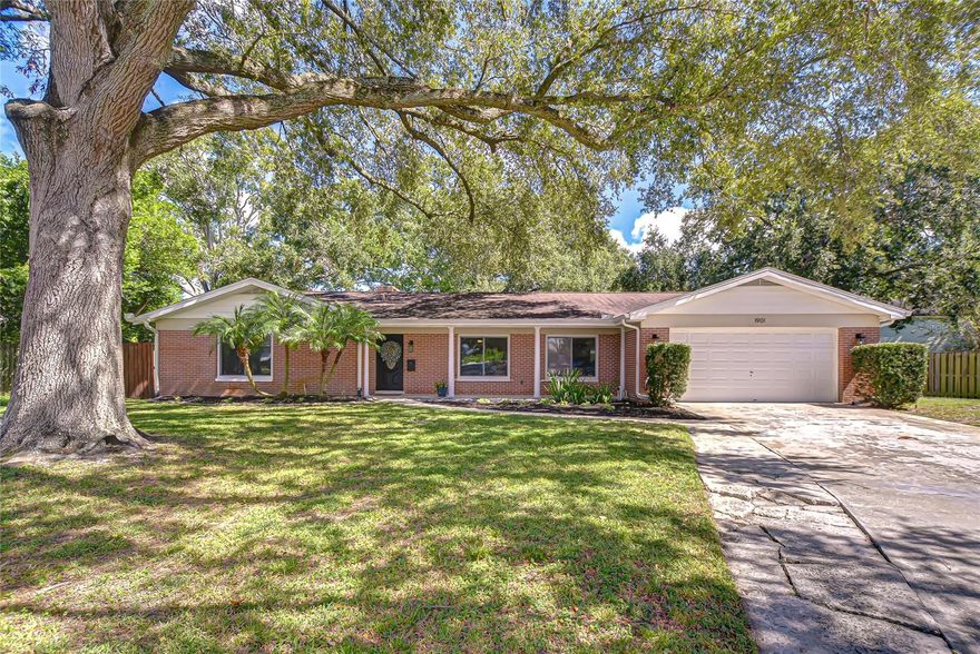 Welcome to this meticulosly maintained 3-Bedroom, 2-Bath, 2-Car Garage, POOL home tucked away on a quiet cul-de-sac in the desirable Lake Magdalene area! Offering over 2,200 sq. ft. of living space, this home features an open and functional layout perfect for entertaining or everyday living. No carpet throughout, brand new luxury vinyl plank flooring was installed within the past year, adding style and durability. The kitchen boasts granite countertops, wood cabinetry, and a functional eat in bar, opening to the spacious dining and living areas with ample natural light. The versatile bonus room can serve as a home office, playroom, or converted to an extra bedroom. Step outside to your private backyard HOMESTEAD  featuring a sparkling pool, large patio, and freshly mulched flower beds. The yard also includes a charming CHICKEN COOP (can stay with the home), a beautiful high-end playground, and plenty of space to grow your own garden. The sellers currently have several blueberry plants and previously maintained a thriving vegetable garden—if you’re looking for the perfect homestead, everything is already here waiting for you! Additional outdoor features include a large concrete slab on the side of the home; ideal for parking a boat, RV, or extra vehicles. LOW optional HOA only $50 per year provides access to the private Ski Size Lake Magdalene boat ramp, basket ball court, picnic area, park and fire pit. Residents also have the option to rent a kayak slip for a low annual fee! Conveniently located near top schools, shopping, and major highways, this home offers comfort, charm, and a wonderful neighborhood! Don’t wait, this WONT LAST LONG!