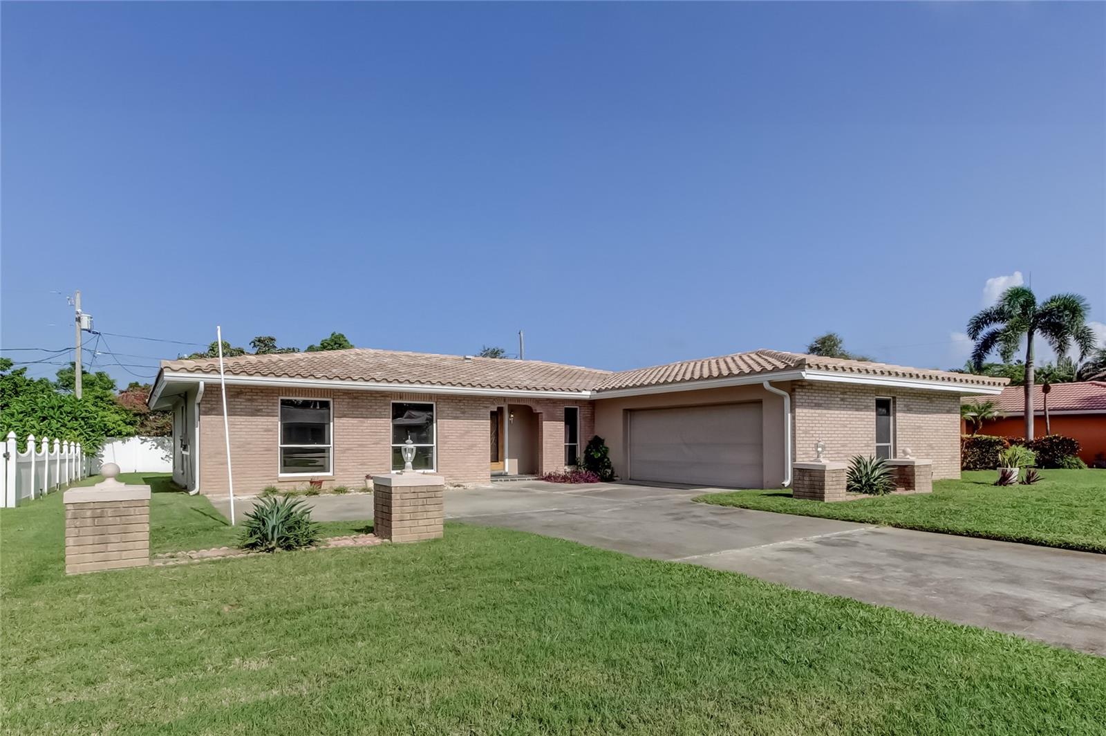 Welcome to Imperial Point, this 4 bedroom 3 bath home is being offered For Sale for the first time in almost 30 years. Step inside, Terrazzo Floors throughout the entire home, large formal living area flows into the dining area and great room. The Primary bedroom is separated from the other three. Bedroom 2 and bedroom 3 share a jack-n-jill bathroom. The spacious kitchen opens to the great room and sliders to your outside screened lanai. Oversized spacious 2 car garage with built in workshop area.The tile roof was replaced in 2014, hot water tank in 2023 and A/C was replaced in 2025. Now let's talk about the amenities that come with living in the Imperial Point HOA Community. Clubhouse and Clubhouse activities, heated swimming pool, play ground, tennis courts, fitness center, billiards room, kids game room, fishing dock, boat docks, private boat launch into the intracoastal waterway, social activities and the list goes on. Come see this one Today!