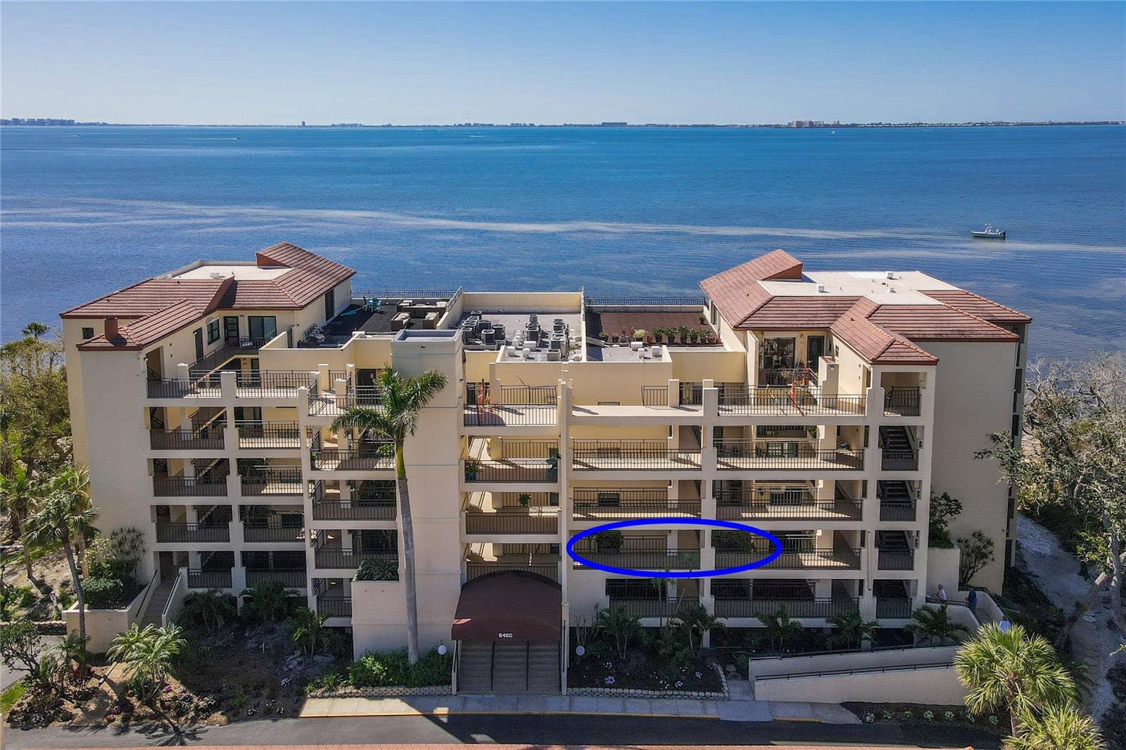 Welcome to the pinnacle of coastal living. This property offers incredible views of both, Sarasota Bay and Longboat Key. From the front door you will see directly to the bay, and enjoy the tranquil views of various birds, palm trees, and tropical walkways. Surrounded by the best of seaside living.Enjoy nearby beaches of Anna Maria Island ,abundant fishing and boating, refreshing pools, IMG Golf and Country Club, and wonderful dining and entertainment of downtown Sarasota and Bradenton. Inside, enjoy two spacious bedrooms each with a walk-in closet. The bedrooms are thoughtfully located on opposite sides of the home to allow for privacy when house guests visit. Full size laundry facilities are located just off the kitchen. The kitchen is original but spacious and easy to renovate. There are also several storage closets for beach chairs, and umbrellas and bikes. Enjoy the greatest location. And rest assured this building has passed the Milestone Inspection. So, if you're ready to put your feet in the sand and enjoy a carefree resort lifestyle, this is the perfect location.