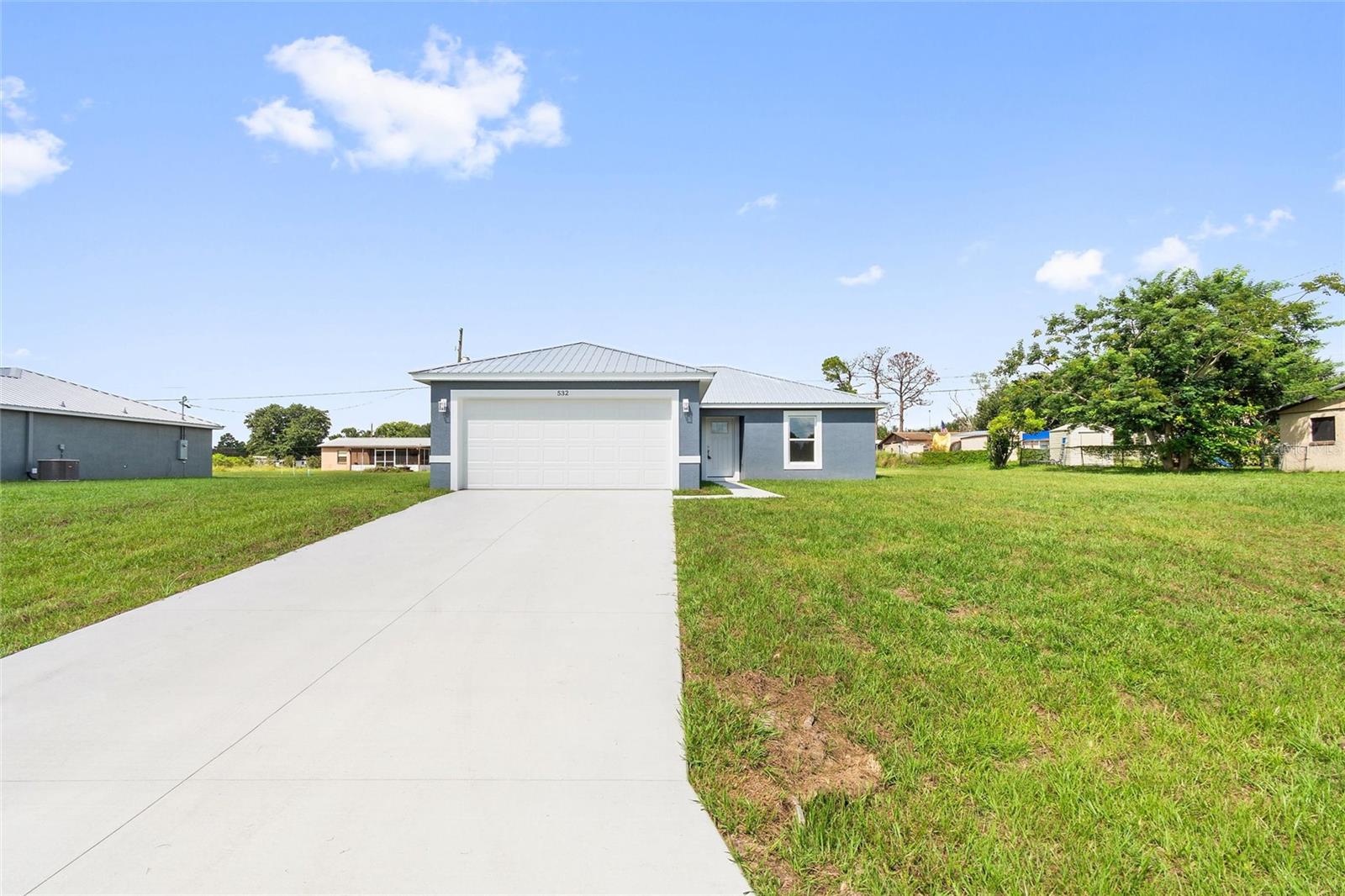 Welcome home to this beautiful new 3-bedroom, 2-bath home conveniently located just off Highway 27 in Frostproof—ideally situated in Polk County with easy access to Avon Park, Sebring and more! Inside, you’ll find stylish granite countertops in both the kitchen and bathrooms. The master bathroom features a stunning tiled walk-in shower, while the guest bath offers a relaxing tub with tile surround. The kitchen is thoughtfully designed with ample storage, modern cabinetry, and brand new stainless steel appliances—perfect for everyday living and entertaining. Enjoy peace of mind with a durable metal roof—no shingle replacements needed!