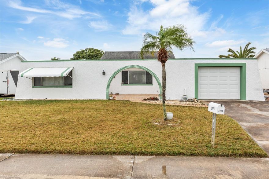 Welcome to this charming two bedroom, two bath home with a spacious Florida room that offers beautiful water views. The semi-open floor plan features updated kitchen counters, and fresh paint, along with new flooring installed after last year’s storms. Enjoy the serene water view complemented by a mature tree in the backyard, perfect for fishing and budget friendly lifestyle. The home has been lightly used over the past five years, ensuring it’s in great condition. The second bedroom features its own bathroom, and there’s a separate dining room plus a large living room area. Don’t miss out on this wonderful opportunity!