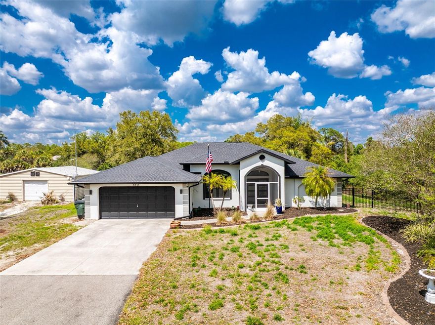 Ready to enjoy your own private retreat where even the chickens are welcomed, look no further.  Set back, at the end of your long, paved driveway, awaits your newly updated home. Not only does peace come from the land that surrounds you at 2 plus acres, you can enjoy peace of mind knowing that the roof, ac, windows, front door, appliances, exterior painting, and fencing were all updated within the last 5 years. Bring some of the peacefulness of the outdoors through the sliding back doors, as you have the ability to open up your living room to the screened in pool patio. Let the laughter of the summer days, and the cooler evenings of the winter fill your living space. The updated kitchen allows for entertaining, with a eat-at bar and breakfast nook. Use the formal dining room for guests or your family dinner/gatherings. Retreat to your private bedroom, shut off from the rest of the house with pool access, while still leaving others to enjoy their privacy in the two extra bedrooms. Don't want to join a gym? Utilize the detached metal building, with its own split AC as your personal gym or convert to a space that suits your needs.  So much to offer, it is truly something to see for yourself.