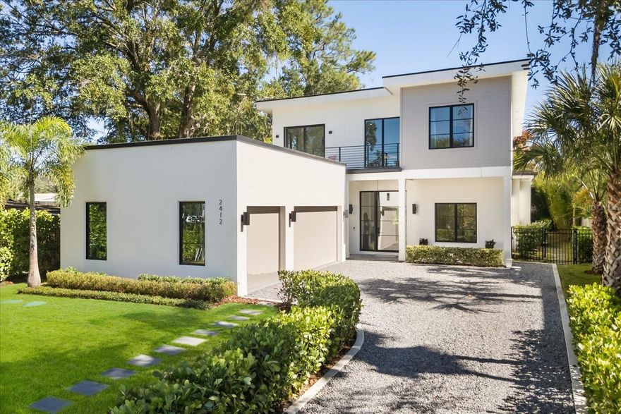 Step into a world of modern elegance in this newly completed estate in the heart of Winter Park. Masterfully constructed, this five-bedroom residence with six full and one half baths spans over 4,500 square feet of luxurious design and comfort. From the moment you enter the soaring foyer, light pours through expansive windows that frame every angle of the open floor plan, creating a seamless connection between indoor and outdoor living.
The main level showcases a grand living and dining area anchored by a statement fireplace and a chef-inspired kitchen featuring premium appliances, European cabinetry, a large center island, and a walk-in pantry designed for effortless entertaining. The primary suite offers tranquil views of the pool and gardens with a spa-inspired bath featuring a freestanding soaking tub, dual rain showers, and a custom double vanity. A second ensuite bedroom on the first floor provides flexibility for guests or an elegant home office.

Upstairs, an airy loft and media lounge open to a private balcony overlooking the grounds. Three additional ensuite bedrooms each feature generous walk-in closets, offering comfort and privacy for family and guests alike.

Outside, an expansive covered lanai with a summer kitchen and retractable screens overlooks a sparkling saltwater pool surrounded by lush landscaping and an outdoor bath for convenience. The oversized lot allows for both grand entertaining and peaceful retreats, while the three-car garage with EV charging and a paver driveway add practicality to the home’s modern luxury.

Perfectly positioned near Park Avenue, Hillstone, Interlachen Country Club, and top-rated private schools, this home delivers an elevated Winter Park lifestyle where design, comfort, and location converge effortlessly.