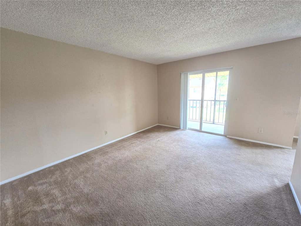Photo of 9933 Sweepstakes Lane #4, Orlando, FL 32837 (MLS # O6414118)