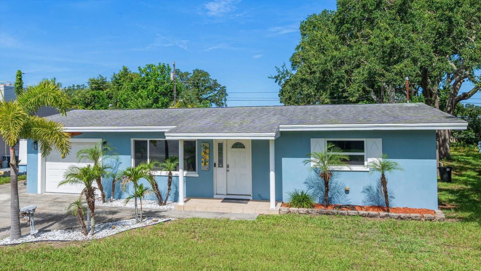 Welcome to this charming Dunedin haven, perched high and dry in a coveted no flood zone and perfectly poised for investors seeking income or buyers craving a full time Florida retreat. A breezy golf cart ride lands you in vibrant Downtown Dunedin, with its eclectic shops, eateries, and year-round events, while at home neutral tile floors flow through a traditional yet flexible layout. Gather in the sun splashed family room crowned by a shiplap accent wall, then move into the generous dine in kitchen offering abundant counters, a pantry, and room for culinary creativity. Light filled bedrooms boast plentiful closets and beautifully updated baths. Need more options? An interior laundry doubles as an office with its own full bath and walk in shower, plus a bonus room awaits your vision - playroom, formal dining, gym…the possibilities are endless. Slide outside to an entertainer’s paradise: a huge screened four-season room with ceiling fans offers bug-free comfort and year-round enjoyment, while a shimmering pool with sundeck, privacy fenced yard, one car garage, and gated parking for your boat, golf cart or RV extend the fun. A detached, air-conditioned shed/workshop, plumbed with water, presents exciting potential as an in law suite or lucrative rental. Recent upgrades, including impact-rated windows and fresh paint, add peace of mind. Just minutes to Honeymoon Island’s powder soft sands and world-famous Gulf beaches, this is a fantastic opportunity in an unbeatable location. Act quickly before it’s gone!