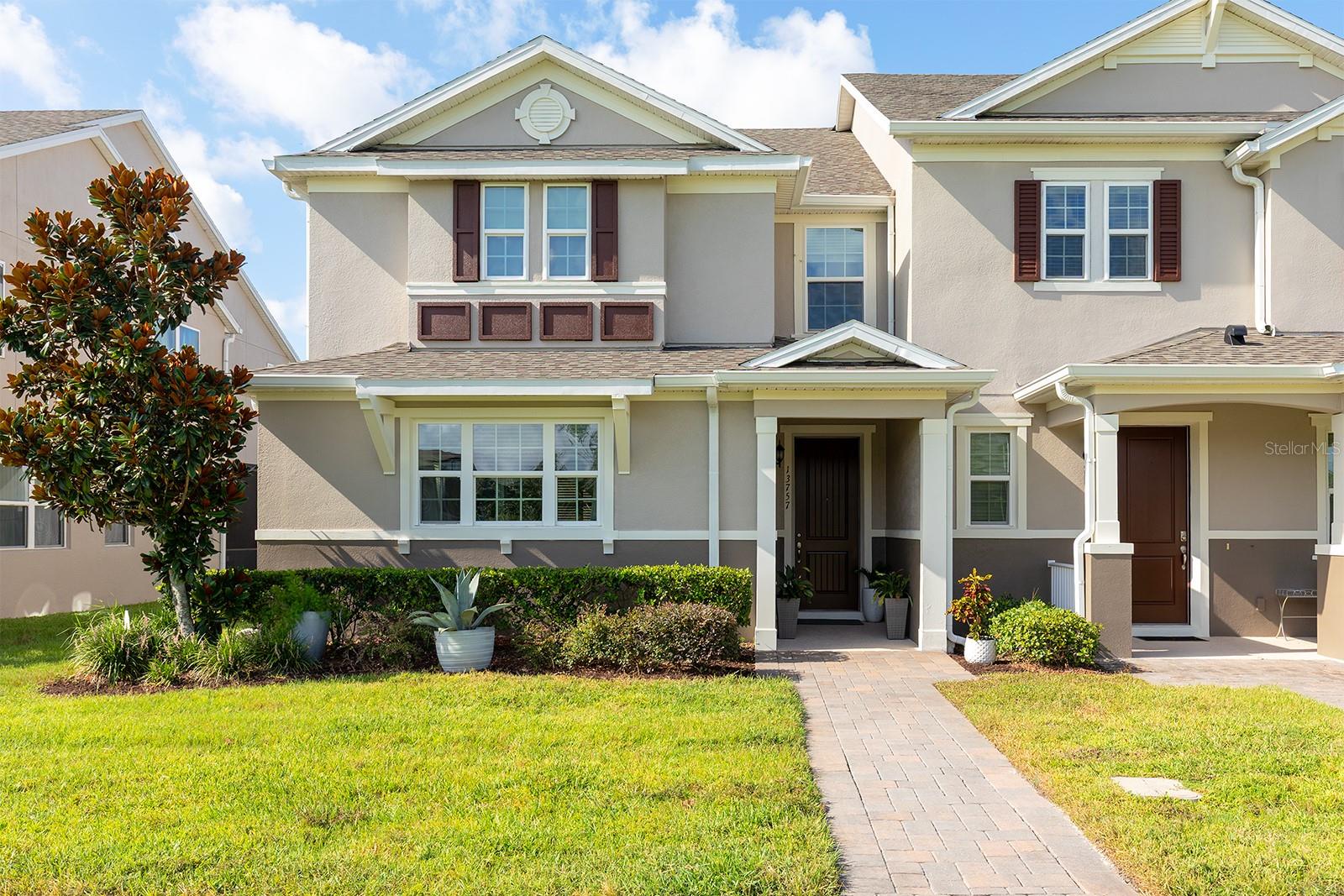 Enjoy a low maintenance lifestyle with this two-story townhome, built in 2019, seconds from modern conveniences in the heart of Windermere. This well-maintained townhouse offers a comfortable living environment with a brand new roof, gutters, downspouts, and additional upgrades, resulting in a low electric bill, making it ready for years of memories. An open, combined main living space welcomes you inside with high ceilings and great natural light, creating a warm atmosphere to enjoy each day or entertain guests. The stunning kitchen is adorned with an island, an upgraded sink faucet, a breakfast bar, a pantry closet, granite counters, and plenty of cabinetry for storage. Upstairs, the primary suite has a private bathroom, and all three bedrooms are generously sized with large closets, making them the perfect private retreat. The spacious loft adds a secondary living space, providing ample room for relaxation and entertaining. A cozy covered patio and vinyl-fenced side yard provide a lovely outdoor living space, while the alley-access two-car garage features custom epoxy flooring (2023). Adding to the quaintness of this property, the front of the townhome boasts a pond view, which includes a view from the kitchen and two bedrooms. Residents enjoy access to two community pools and multiple trails, ideal for maintaining a balanced lifestyle. Two playgrounds and two dog parks are present to accommodate residents’ needs. The location provides excellent convenience for families, with proximity to quality educational options including Keene's Crossing Elementary, Bridgewater Middle School, and Windermere High School. Daily errands and adventures become effortless with a Publix-anchored shopping plaza seconds away, plus the Winter Garden Village and many more dining and shopping options within a short drive. For Disney fans, local roads take you directly to its doorsteps. The combination of practical features, recreational amenities, and proximity to modern conveniences, creates a pristine environment that perfectly balances comfort with convenience. Schedule your private showing today!