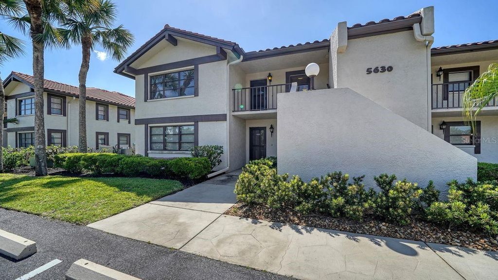 Photo of 5630 Golf Pointe Drive #205, Sarasota, FL 34243 (MLS # A4645005)