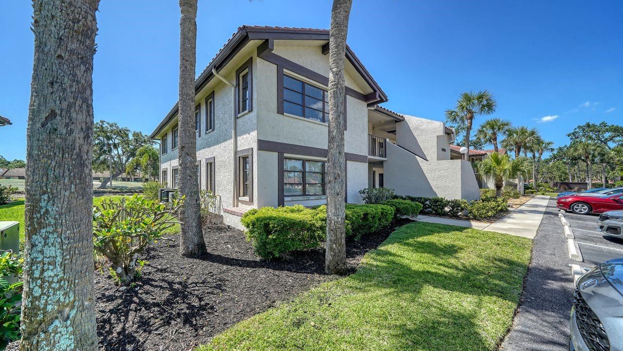 This oversized three-bedroom condo at Golf Pointe is beautifully updated and available turnkey furnished. The second-floor end unit is light and bright with views of the creek and golf course beyond. The updated kitchen has a new stainless refrigerator, stove and sink/faucet, plus pass through to the dining area and plenty of storage. The washer and dryer are conveniently located in a closet in the kitchen. The primary bedroom has an ensuite bath with shower, closet with mirrored sliders and a walk-in closet. The third bedroom is being used as a den/office with sliding pocket doors to the living room giving added space for entertaining or a sofa bed for additional guests. You'll have peace of mind with a newer HVAC system (2019) and hot water heater (2021). There is an exterior storage room near the front door for beach gear and golf clubs. The large, screened lanai has an expansive view of the Palm-Aire Golf & Country Club course. Short term rentals are allowed with a one month minimum, three times a year. Palm-Aire Country Club golf, tennis, fitness and social memberships are available. Golf Pointe has a community pool for owners and guests. Golf Pointe is conveniently located close to University Town Center Mall, restaurants, the Sarasota downtown arts community, Sarasota airport and local beaches. You'll find easy access to I-75 at University Parkway.