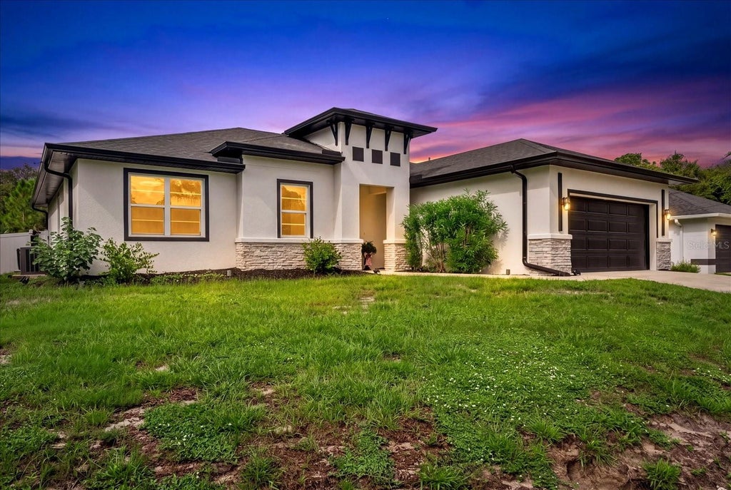 Photo of 5587 Farmington Avenue, North Port, FL 34288 (MLS # C7530366)