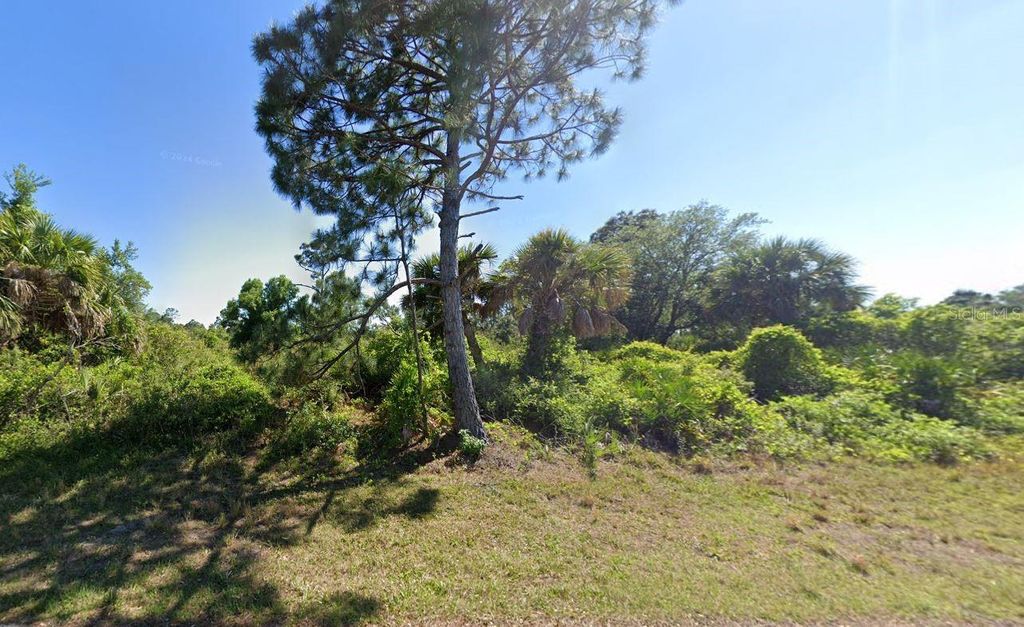 Photo of 12189 Grace Avenue, Port Charlotte, FL 33981 (MLS # C7495214)