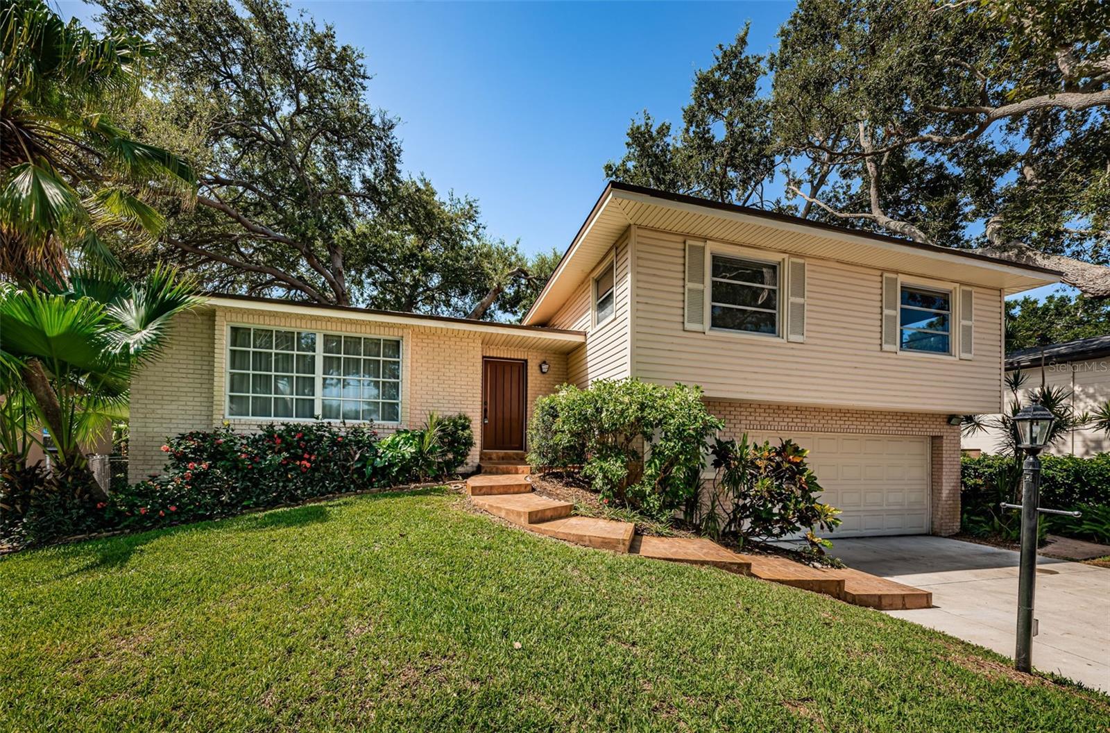 One or more photo(s) has been virtually staged. Welcome to this well-maintained 4-bedroom, 3-bathroom home offering 2,117 square feet of versatile living space in the sought-after Orange Terrace community of Seminole, awaiting your personal touch. Pre-listing inspection was completed to create a stress-free buying experience. Nestled in a non-flood zone, this property combines comfort, function, and location.
A beautiful bay window in the main living room brings in natural light and leads seamlessly into the dining area and kitchen, which features an eat-in space perfect for casual meals. Downstairs, you’ll find a spacious family room with a wood-burning fireplace, ideal for gatherings or a flex space to suit your needs. Glass sliders open to the beautifully sized backyard, creating a great indoor-outdoor flow. This lower level also includes a full bathroom, laundry area, and access to the two-car garage.
Upstairs, the primary suite features a private bathroom, while three additional well-sized bedrooms share a second full bath.
Additional highlights include a brand-new water heater and a pre-listing inspection already completed,
Conveniently located just minutes from beaches, shopping, dining, and top-rated schools, this home offers both lifestyle and value.
Don't miss this opportunity to make Orange Terrace your home!
