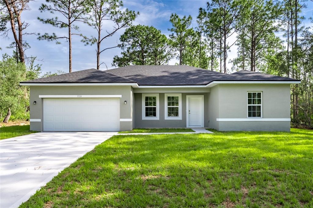 Photo of 9324 N Fairy Lilly Dr, Citrus Springs, FL 34434 (MLS # O6316680)