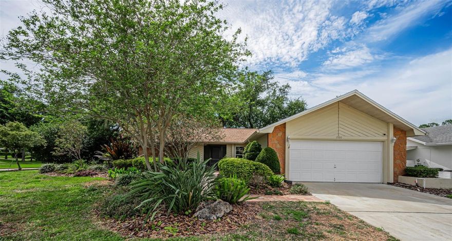 One or more photo(s) has been virtually staged. Enjoy living an active lifestyle in desirable Highland Lakes on Lake Tarpon in Palm Harbor! Situated on an elevated corner lot, you’ll fall in love with the serene back yard views overlooking a picturesque sloping retention area.  Lush landscaping creates a privacy buffer to enjoy your peaceful retreat.  As you enter this 3-bedroom,  2 bath home, you’ll notice features that will delight: an open split bedroom floor plan, attractive tile and vinyl flooring and windows that create an abundance of natural light. In addition to the living-dining room areas, entertain family and friends in the spacious family room spanning the back of the house accented by large picture windows and a fireplace.  At the heart of the home is the kitchen offering plenty of cabinetry and an eat-in area for casual dining.  The primary bedroom has luxury vinyl flooring, a spacious walk-in closet, dual sink vanities and French doors to the family room. Two additional bedrooms and a bathroom provide sleeping or office needs.  Enjoy morning coffee out on the pavered patio or grill out surrounded by trees and tropical foliage. Roof was replaced in 2022; AC in 2023. The amenities in this popular 55+ residential community are incredible and include three 9-hole executive golf courses, sparkling Olympic-size pool and spa, tennis & pickleball courts, a clubhouse offering rooms for clubs, crafts, cards, billiards, and an auditorium for social events & movies.  On the shore of Lake Tarpon sits The Lodge with a heated pool, patio, dock, pontoon boats and much more.  Highland Lakes is conveniently located near shopping, restaurants, gorgeous gulf beaches, county parks and all that Tampa Bay has to offer.  Two international airports are a short commute away.  Come experience resort-style living!