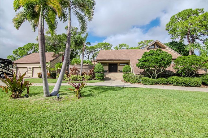 Welcome to this stunning home located on Bardmoor Golf course, offering breathtaking panoramic views. This three-bedroom, four-bath home is situated on a double lot, providing a grand entrance with an extraordinary view between the 8th hole and the 9th tee box. The architectural design features column accents and high wood ceiling beams, adding to the overall appeal of this elegant home. Step into the sunken conversation fire pit, adorned with beautiful copper accents, and enjoy the cozy winter nights. The open kitchen boasts a large center island, ample counter space, a walk-in pantry, granite countertops, and newer appliances. The living area is enhanced with travertine flooring and brand new sliding doors and windows, allowing for plenty of natural lighting. The primary bedroom offers two balconies, a spacious walk-in closet, and a luxurious marble bath with a roman spa tub. Additional features of this home include a large lower-level laundry area, as well as second and third bedrooms with their own baths. Up the spiral staircase, you'll find a generous loft/office area with picturesque fairway views, perfect for working or relaxing. There is also a media/flex area for your entertainment needs. The oversized two-car garage includes a loft area for additional storage. This home is equipped with newer HVAC systems and irrigation on a well. Additionally, there is a brand new 10x16 tall shed with electric, providing even more storage space. The large driveway can accommodate all your toys, and the best part is, there is no HOA, no CDD and no flood zone. For golf enthusiasts, this home is just steps away from the members-only Bayou Club and Bardmoor Golf course and restaurants, where you can enjoy tee time at your convenience. The community is also home to the prestigious Harry Hopman Tennis facility, featuring 14 Har-Tru and hard tennis courts, as well as pickleball courts. Located  in close proximity to Seminole Park, Clearwater and Tampa international Airport and 15 minutes to Florida's finest white sandy beaches, this residence offers the perfect combination of luxury, convenience, and natural beauty. Don't miss your chance to own this rare find and exceptional property.