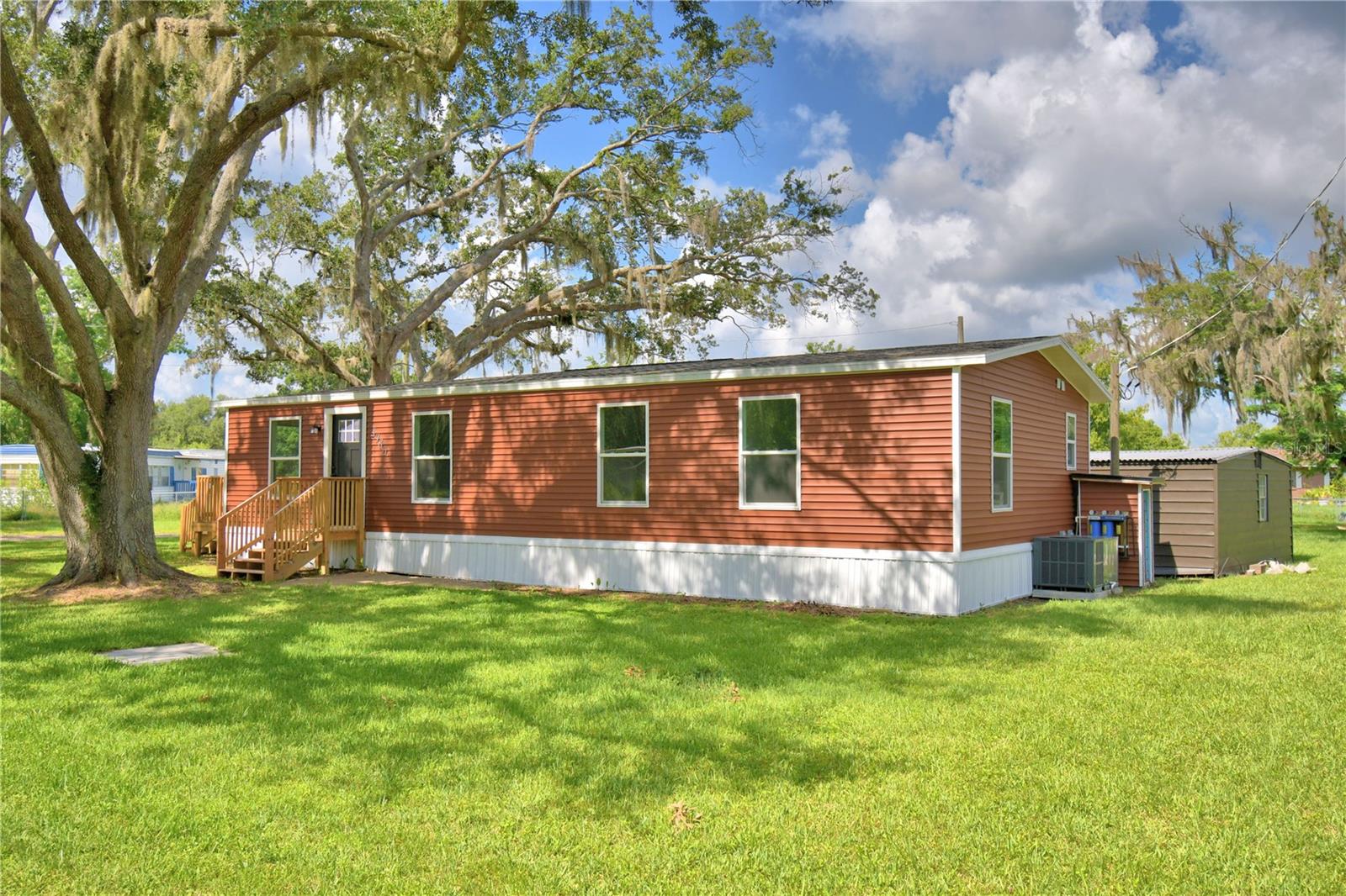 Lake Life Meets Country Comfort!
Discover this brand-new 3-bedroom, 2-bath manufactured home perfectly situated just west of Haines City in a peaceful country setting. With an open floor plan and abundant natural light, this home offers easy living and modern touches throughout—including durable laminate flooring (no carpet!) and a stylish kitchen complete with stainless steel appliances and a center island.
Enjoy exclusive lake access to private Lake Lowry, ideal for fishing, boating, or simply relaxing by the water. The property includes canal frontage and a shared boat dock, making it a dream for outdoor enthusiasts.
Set on a beautiful, irregular-shaped lot, there’s plenty of room to enjoy the outdoors, plus an outdoor workshop/utility building that features a second laundry area for added convenience. All this, just a short drive from shopping, dining, and medical facilities in Haines City.
Whether you're looking for a peaceful retreat or your primary residence, this home offers the best of both worlds—modern comfort and lakeside living!