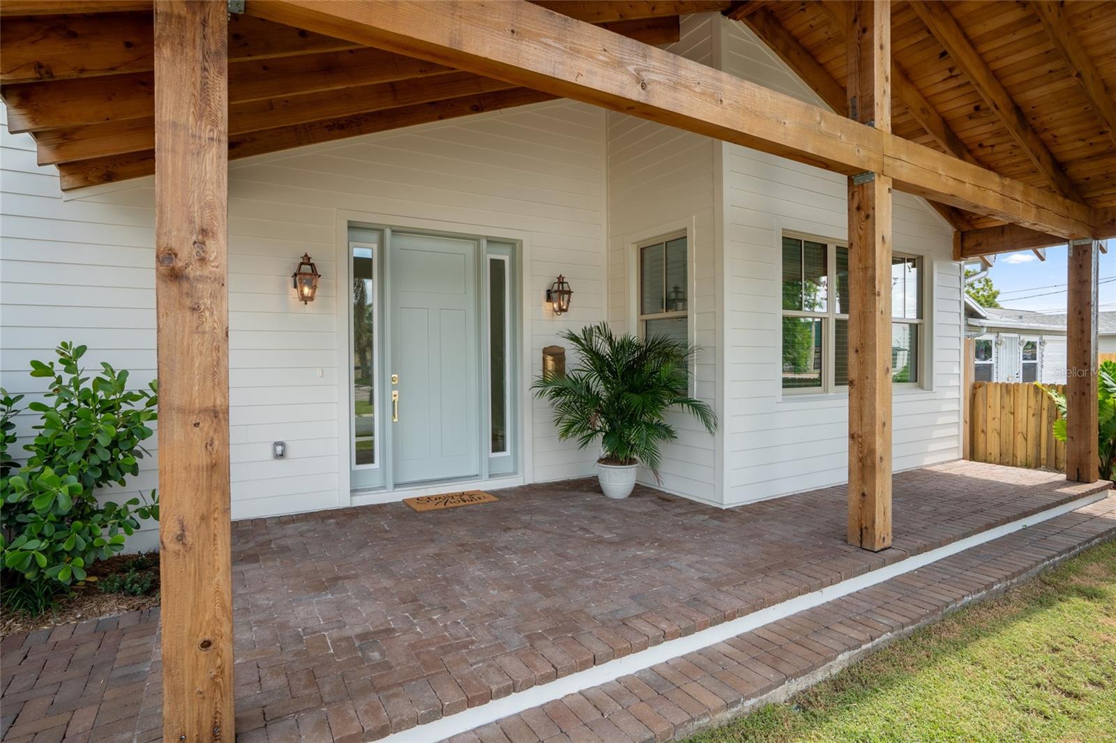 Be the first to live in this beautifully designed new construction rental located in the coveted Magnolia Heights neighborhood! Built by local home builder, Coastline Development, this home features 3 bedrooms, 2 bathrooms, 1490 SFT, laundry closet with stone countertop & upper cabinets for additional storage, and a flexible bonus space that could be dining, home office or playroom. Situated along side two other available units (TB8410223 which is 2/1 and TB8410347 which is a 1/1), there is also a 2 car garage which is available at an additional fee per month. From the welcoming cedar wood-beam front porch to the crisp white siding and tropical landscaping, every detail has been carefully considered. Upon entering, soaring vaulted ceilings and skylights fill the home with natural light, creating an open, airy feel. The heart of the home is the beautifully designed custom kitchen which offers all wood cabinetry, gleaming stone countertops, stainless steel appliances, and a large island that offers storage and functionality. Whether you’re prepping a meal or gathering with friends, this kitchen is a true showpiece. The bathrooms bring a mix of luxury and personality. The primary suite boasts a spa-like retreat with a custom-built white oak vanity, elegant wallpaper accent, and a walk-in glass shower with sleek, modern finishes. The guest bath adds a playful pop with bold blue tile in the tub/shower combo, a wood vanity, and a scalloped mirror — all tied together with high end fixtures and thoughtful details. Every inch of this home was carefully crafted with both style and functionality in mind. Enjoy the benefits of new construction, low-maintenance living, and a well-designed layout perfect for today’s lifestyle. Rental rate to include lawn maintenance, natural gas, and pest control. Conveniently located in the heart of St. Pete - minutes to grocery, dining, breweries, shopping, and our vibrant DTSP! Easy access to I275 to Tampa or our beautiful sandy Gulf Beaches. Be the first to call this high-quality coastal retreat home — schedule your private showing today!