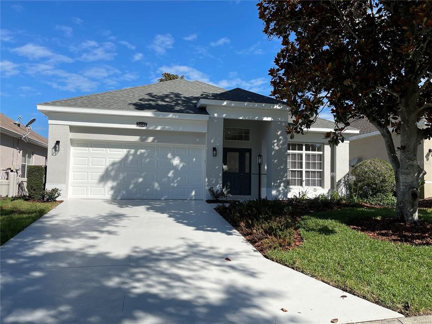 Golf-Front Serenity & Modern Luxury: Welcome home to 24345 Amberleaf Court, a spectacular 3-bedroom, 2-bathroom residence perfectly nestled inside The Plantation at Leesburg, Central Florida’s premier 55+ guard-gated resort community.Step inside this home and you will be absolutely blown away! This property feels ALMOST BRAND NEW because practically everything inside has been completely reimagined and updated. You get ultimate peace of mind knowing the heavy-lifting is already done, featuring a NEW ROOF (2021) and a NEW A/C (2022).You will absolutely LOVE the BRAND NEW modern kitchen showcasing custom solid wood cabinetry with soft-close drawers, gorgeous quartz countertops, and a full suite of BRAND-NEW stainless steel appliances including an beverage fridge in the custom Island. Beautiful, BRAND-NEW luxury flooring flows seamlessly throughout the entire home—complemented perfectly by NEW interior & exterior paint, NEW ceiling fans, and NEW blinds.The primary suite is STUNNING, offering a spacious walk-in closet and a FULLY RENOVATED en-suite bath complete with a custom solid wood vanity, premium quartz counters, custom tile, shower glass, custom lighting and fixtures. Step out back to your covered and enclosed patio overlooking calm, relaxing views on a premium lot located right on the golf course. This home is 100% MOVE-IN READY, allowing you to bypass construction delays and immediately start enjoying resort-style amenities including two championship golf courses, three heated pools, tennis, pickleball, fitness centers, and an on-site restaurant. Hurry and schedule your tour today—turnkey homes like Brand New with this level of detail do not last long!