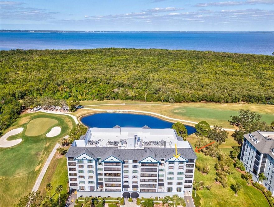 Welcome to this exquisitely updated 3-bedroom, 2-bath top-floor penthouse corner unit, where sweeping views and thoughtful design create a truly elevated living experience. Perched above a championship golf course that proudly hosts PGA tournaments, this home offers a front-row seat to stunning fairways, shimmering water, and the excitement of tournament play. Tile (new 2020) and wood flooring flow throughout the open living, dining, and kitchen areas, seamlessly connecting to a wrap around screened-in balcony through multiple sliding glass doors bringing in plentiful natural light—perfect for morning coffee, sunset cocktails, or simply soaking in the serene scenery. The kitchen which opens into the living room is a perfect blend of style and function, featuring sleek stainless-steel appliances (12/2020), granite countertops, recessed lighting, a convenient closet pantry, and a reverse osmosis system serving both the sink and refrigerator—ideal for both everyday living and entertaining. The primary suite is a private retreat, thoughtfully positioned away from the other bedrooms to create a true split-bedroom floor plan. It boasts a 6.7 x 5 walk-in closet with custom built-ins, a ceiling fan, views from the large window and an en-suite bathroom with granite countertops, split dual vanities, a private water closet, and a walk-in shower, your own sanctuary of comfort and style. The second bedroom features wood flooring, a ceiling fan, a built-in closet and sliding glass doors opening to the balcony, while the third bedroom includes a generous 6.10 x 7 walk-in closet and a ceiling fan. All bedrooms offer spectacular views of the golf course and water. The guest bathroom is elegantly finished with granite countertops and a tub/shower combination. Additional highlights include 2021 installed hurricane-rated windows throughout, new A/C unit in 5/2024 with 10-year warranty, new hot water heater 11/2025 with 6-year warranty, an in-unit laundry room with enough space for a full-size washer and dryer, a coveted under-building parking space and garage storage locker. With abundant in-unit storage, including multiple walk-in closets, storage closets, and generous cabinetry, this penthouse combines everyday comfort with the prestige of living on a PGA tournament golf course. Ideally located close to restaurants, shopping, Clearwater Airport, and just minutes from the white-sand beaches, this home offers the perfect blend of luxury, convenience, and coastal lifestyle.