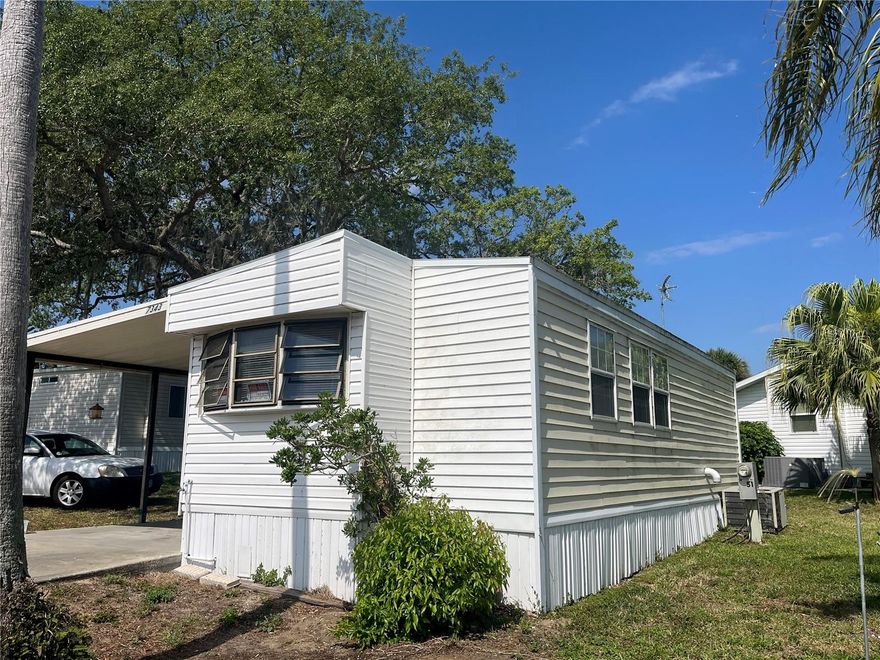 Looking for affordable winter ger away or year around living?    this furnished older park model  one bedroom- one bath mobile home with large utility/storage room with washer & dryer could be the answer.  Access to beautiful open pool overlooking the lake, clubhouse, pier to fish from and be as busy as you choose or just chill out in your own private unit. You own your lot.   Carport and small covered porch off the utility room.  This is a smaller well maintained park to enjoy Resort living at a lower price. There is a shuffleboard court to enjoy with the other amenities.  Portable A/C unit cools whole mobile.  Only minutes from shopping