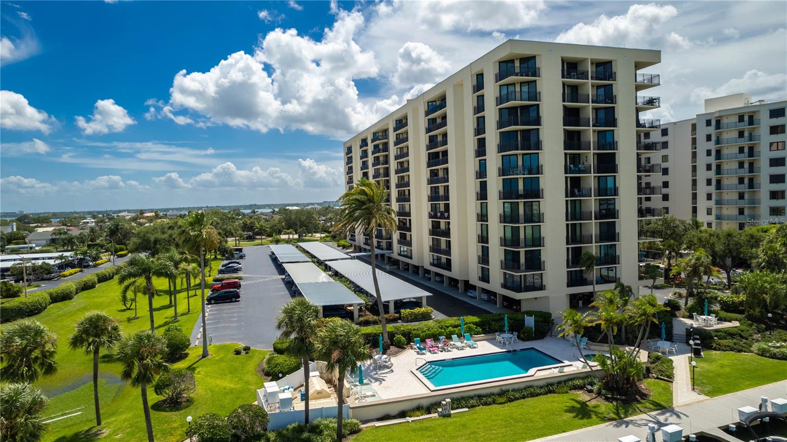 Wake up to the beauty of water views every morning and the spectacular sunsets over the Gulf. This completely updated 10th-floor condo offers pure luxury from the moment you walk through the door. With stunning views and modern upgrades throughout, this spacious residence boasts an open layout with designer finishes and panoramic water views of the Intracoastal and Gulf from every room.
Hurricane-rated sliders lead out to a large private balcony, perfect for sunsets and outdoor lounging. High-end touches include custom cabinetry, detailed moldings, modern appliances, and motorized blinds on all windows and sliders. The custom primary closet and wine bar in the living room add to the home’s luxury appeal. Additional recent upgrades include a 2021 AC with in-unit dehumidifier and a water softener system, designed for comfort and worry-free living. The building offers resort-style amenities, including a pool, hot tub, tennis courts and barbecue grills overlooking Mandalay Channel. A designated under-building parking spot ensures convenience on hot or rainy days.
Located in the highly desirable Island Estates neighborhood, just a mile from the #1-ranked Clearwater Beach with its powdery white sands, this self-contained community offers restaurants, a grocery store, salon, pharmacy, and more—all just steps away. You will have peace of mind living in a condo building that has completed milestone inspections and passed. Very well maintained building: Roof 2021, Paint 2022, Balconies and railings 2019. Automated lobby door with key fob, new mailboxes, security cameras, pool heaters and pumps, walkways 2024.