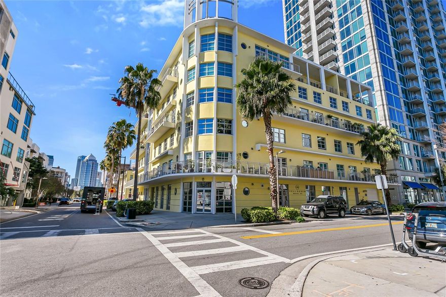 Welcome home to this super chic, urban flat in the popular Channelside District!  Located in The Meridian, a boutique building, you'll enjoy downtown/sunset views, gated parking with two reserved garage spots, and a rooftop pool and club room.  This unit offers soaring two-story ceiling heights, a gorgeous remodeled kitchen with SubZero and other top-end appliances, plus two new(er) bathrooms.  Upstairs, you are treated to a tremendous primary suite with sheer glass overlooking the city, a very comfortable bath, plus spacious walk-in closet with custom closet systems.  If it is privacy you crave, the power operated window shades drop in an instant.  Walk to the gym, grocery store, pharmacy, dog park, restaurants and bars, Water Street, the cruise terminals, and so much more!  Park your car on Friday and leave it there until Monday!