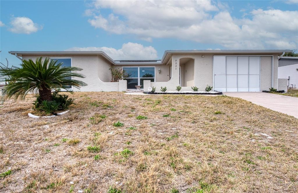 Photo of 9825 Aetna Lane, Port Richey, FL 34668 (MLS # TB8477290)