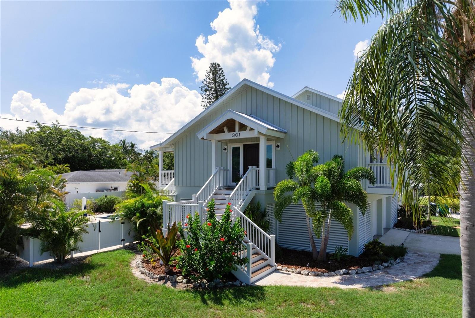 Welcome to your Coastal Retreat in the heart of Anna Maria Island, a true paradise nestled between the sand and sea. This elevated 3-bedroom, 3-bath residence offers an unparalleled Anna Maria Island experience. Just a 3–4-minute walk to the heavenly beaches of Anna Maria Island, perfectly situated north of the iconic Sandbar Restaurant and south of the picturesque Bean Point.
Walk up the grand staircase to step inside and discover a spacious and inviting open floor plan, accentuated by soaring vaulted ceilings that create an airy and expansive atmosphere. The living spaces are bathed in natural light, enhancing the home's warm and welcoming ambiance. A little bit of old Florida cedar ceilings is just the right touch to feel like a local. Just off the kitchen is a covered outdoor porch for an easy, breezy evening meal outside while overlooking the fun pool and spa.
This property boasts a mesmerizing swimming pool, the perfect oasis for relaxation and entertainment, day or night. From heated water in the cooler months to the colorful lighting at night, to the bubblers on the steps, you may stay here all the time. Surrounded by lots of play area for cornhole and such, plus plush tropical landscaping, the pool area offers a serene retreat where you can soak up the sun or enjoy a refreshing dip at any time.
Underneath the house, the entire ground floor is covered with plenty of space for two cars, a golf cart, and a seating area to watch your favorite sports or a movie.
Set on an oversized lot of over 10,000 square feet, this home provides ample outdoor space for your enjoyment or that of your guests. Whether you're hosting family time at the beach, setting up a vacation rental home or simply savoring the tranquility of your surroundings, the possibilities are endless.
Location is everything on Anna Maria. One block off the hustle and bustle of North Shore Drive, this property located on the corner of Holly and Iris creates incredible privacy. Whether taking a leisurely morning walk along the shore, watching breathtaking sunsets over the Gulf of Mexico or relaxing in your the pool's built in spa, you will never want to leave.
Beyond its beauty and comfort, this property offers outstanding vacation rental income potential. Its desirable location, luxurious amenities, and spacious layout make it a sought-after destination for vacationers seeking the perfect getaway. Take advantage of the booming vacation rental market and enjoy an excellent return on investment.
Being sold turnkey furnished, no detail has been overlooked. All new and ready to be enjoyed. Just bring your swimsuit and your favorite book or tunes and you can feel the stress fade away.
Don't miss this rare opportunity to own a piece of paradise in one of Florida's most sought-after beach communities. This exceptional property is not just a home; it's a lifestyle. Contact us today to schedule a private showing and make your coastal living dreams come true.