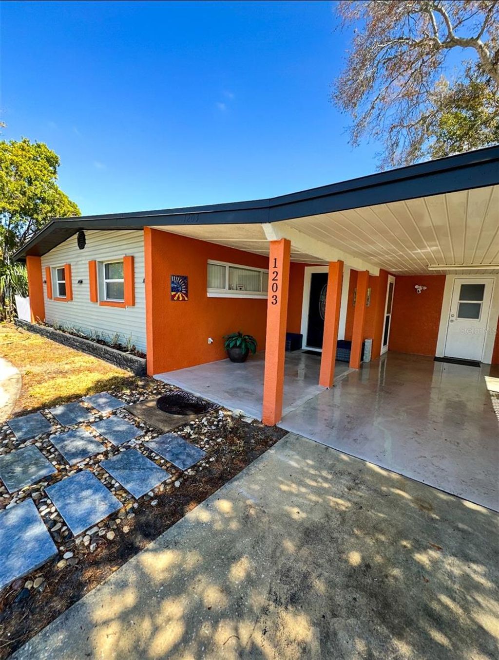 Photo of 1203 N Saturn Avenue, Clearwater, FL 33755 (MLS # O6379922)