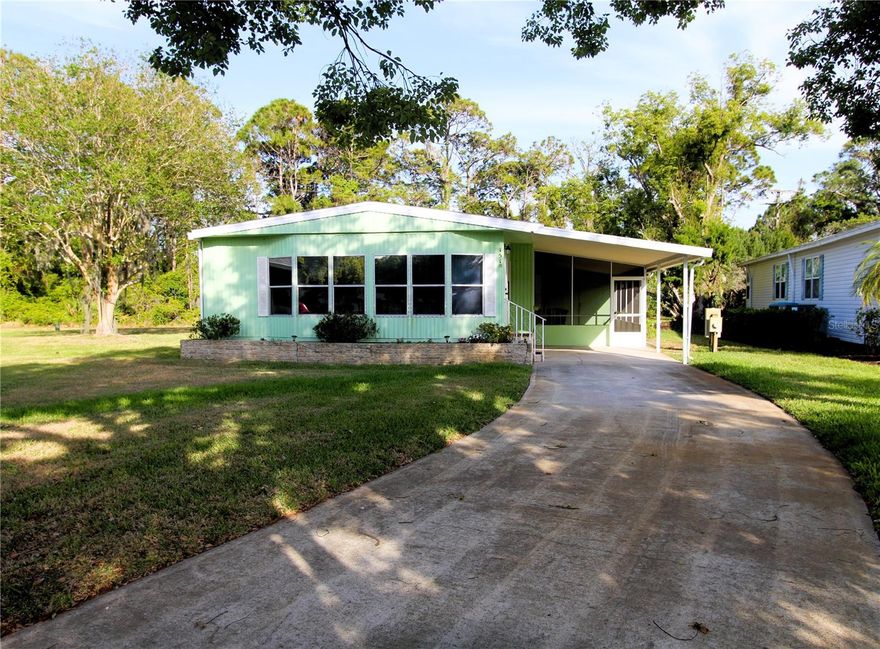 Reduced! Charming two bedroom, 2 bath home is nestled on an oversized cul-de-sac  lot and allows for more space to play especially if you like to garden. This home features fresh paint, vinyl plank  flooring throughout, updated lighting, newer appliances, built-in dining cabinet, new hot water heater and more. Relax on your screened patio while visiting with family and friends. This home is competitively priced and will not last long. All measurements approximate. Not a lot rental community, own your own land. Lighthouse Cove is a gated community where golf carts are a second means of transportation. Enjoy a large, heated swimming pool, recently renovated clubhouse, newly resurfaced pickleball courts, shuffleboard, boat launch for shallow water boats, recreational picnic area on the river and a fishing pier. It is a boating/fishing/shrimping paradise located a short distance from the Mosquito Lagoon. Watch the rockets launch from the fishing pier. Don’t miss out on a great opportunity to live in Paradise.