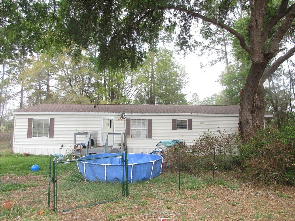 Photo of 5790 SE 183rd Terrace, Ocklawaha, FL 32179 (MLS # OM721882)