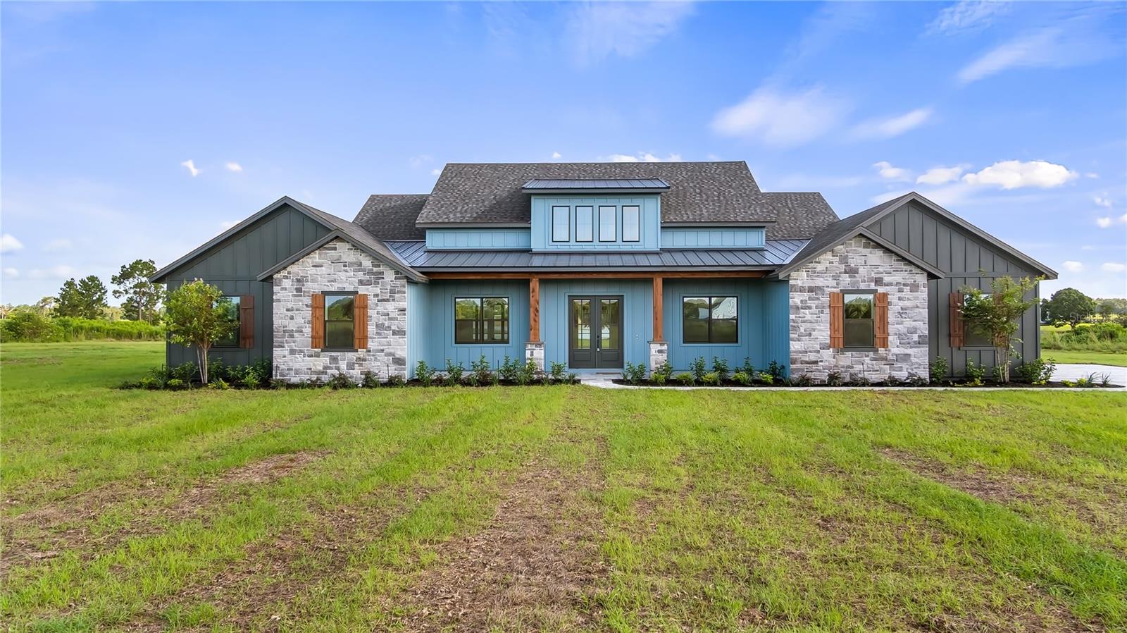 Pre-Construction. To be built. The talented team at Trilogy Homes brings craftsmanship and quality to this custom-built home. Nestled on 4.79 acres on Sugarloaf Mountain, this beautifully designed 5,251 total square foot and 3,501 square-foot living residence offers you the opportunity to select your finishes and truly make it your own. Featuring 4 bedrooms, 3.5 baths, private front and rear porches, a paver driveway leads to an oversized 3 car garage. This home combines elegance and functionality. Entering through the foyer, you'll find a gallery that opens to an incredible open-concept floor plan. The stunning volume ceilings, enhanced with wood-style beams, grace the great room. The kitchen boasts gorgeous quartz countertops, top-of-the-line appliances, a huge walk-in hidden pantry, and an oversized island, perfect for meal preparation and entertainment. The expansive master suite, with coffered ceilings, offers views of the property providing the ultimate in rest and relaxation. The master bathroom features a walk-through shower with multiple showerheads, a soaking tub, and his and her vanities. A walk-in closet has convenient access to the adjoining laundry room. For privacy, a French door opens directly to the lanai. Additional highlights include main-floor bedrooms with high ceilings and ample walk-in closet space, a private office, and a game room with views of the lanai. Call now to schedule an appointment and discover how you can customize this exquisite home to your liking. Minutes from the Minneola Turnpike exit and the new Hospital.